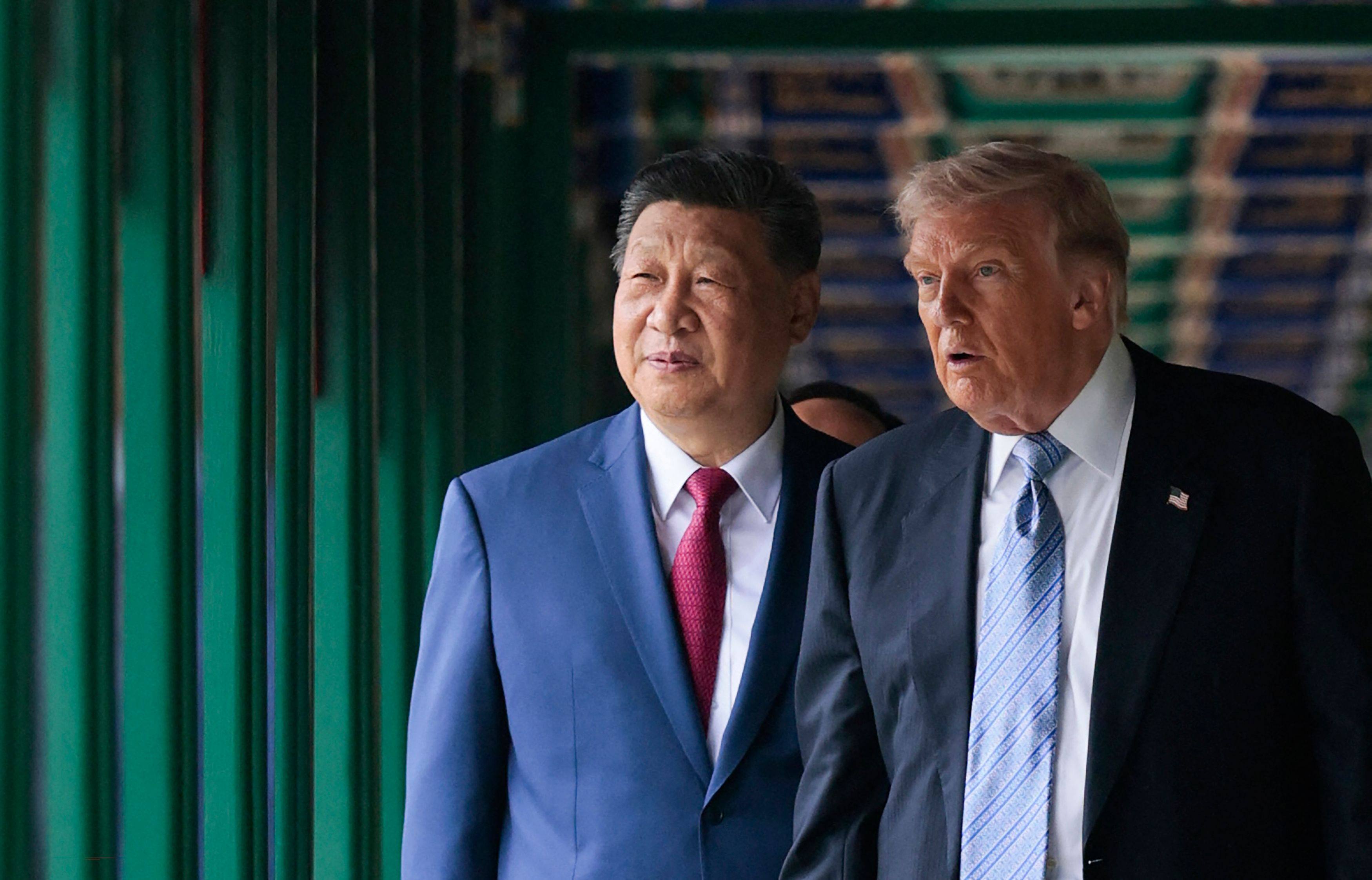 Chinese President Xi Jinping shows US counterpart Donald Trump around the Zhongnanhai leaders' compound, in Beijing on May 15. Photo: AFP