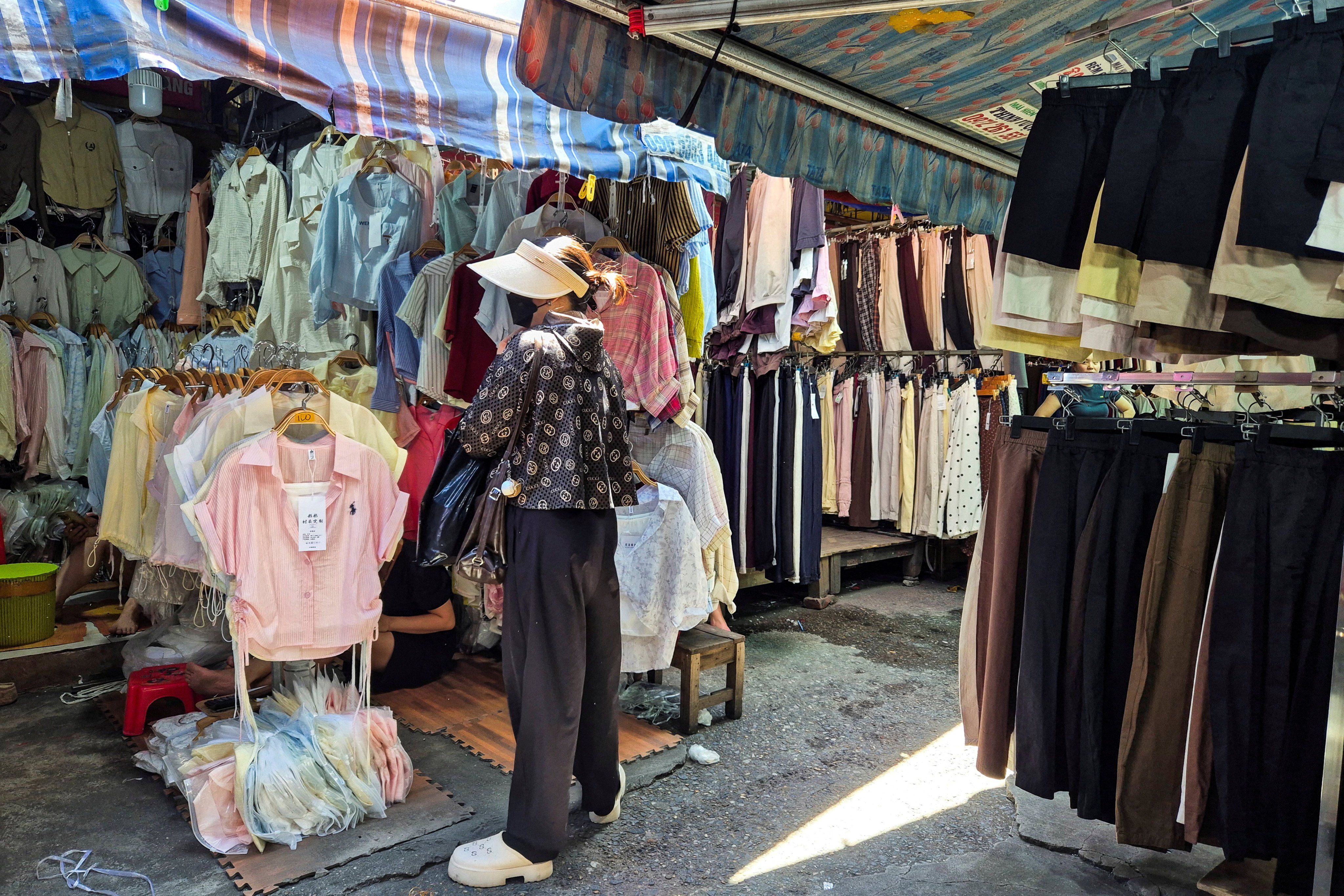 A woman shops at Ninh Hiep market in Hanoi on Monday. Photo: Reuters