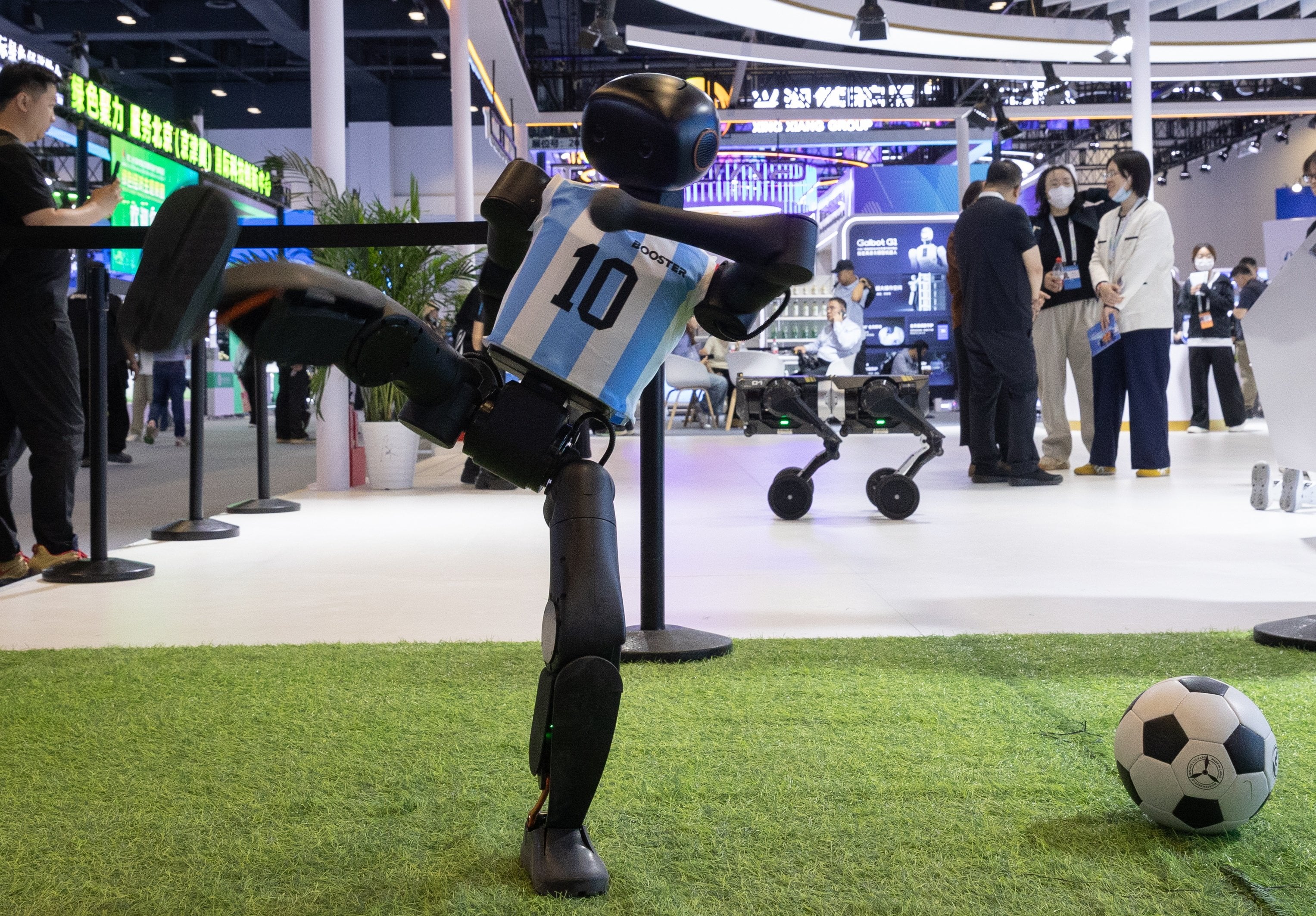 A robot demonstrates its kicking ability at the 28th China Beijing International High-Tech Expo (CHITEC) in Beijing on May 8. Photo: EPA