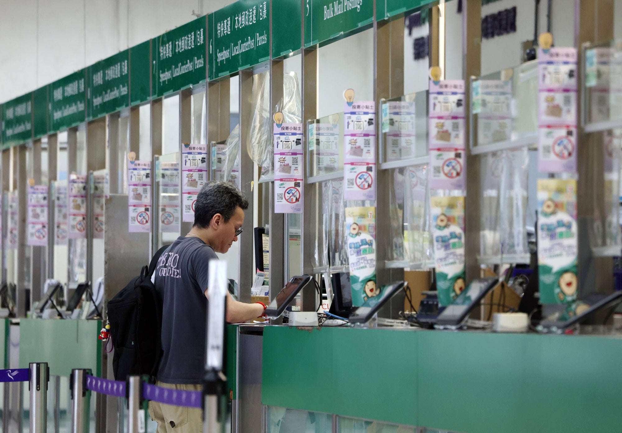 A man visits a post office in Central. Photo: Jelly Tse
