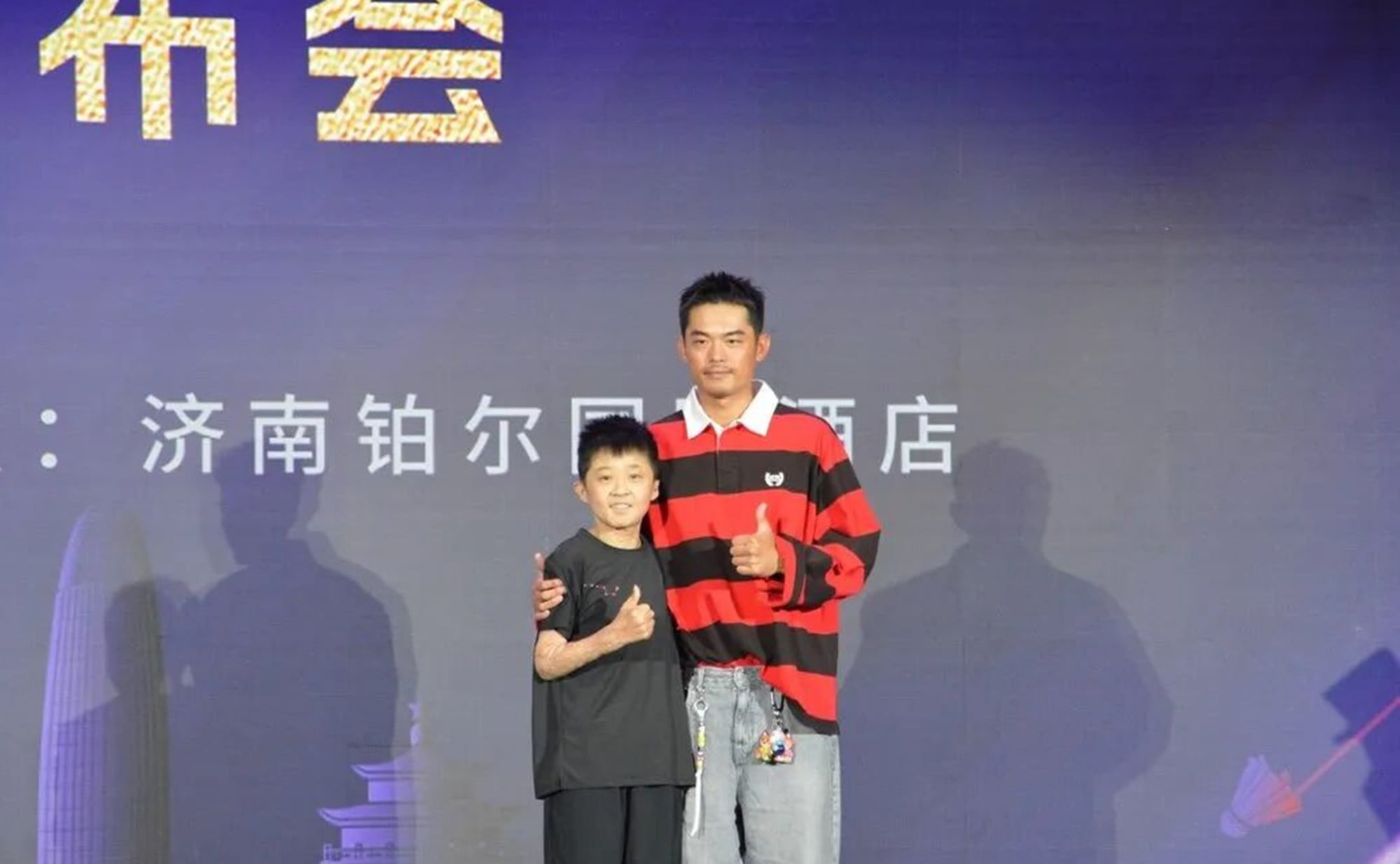 Xuanxuan, above, with his hero Lin Dan, the legendary Chinese badminton player. Photo: cbgc.scol.com.cn Xuanxuan, above, with his hero Lin Dan, the legendary Chinese badminton player. Photo: cbgc.scol.com.cn
