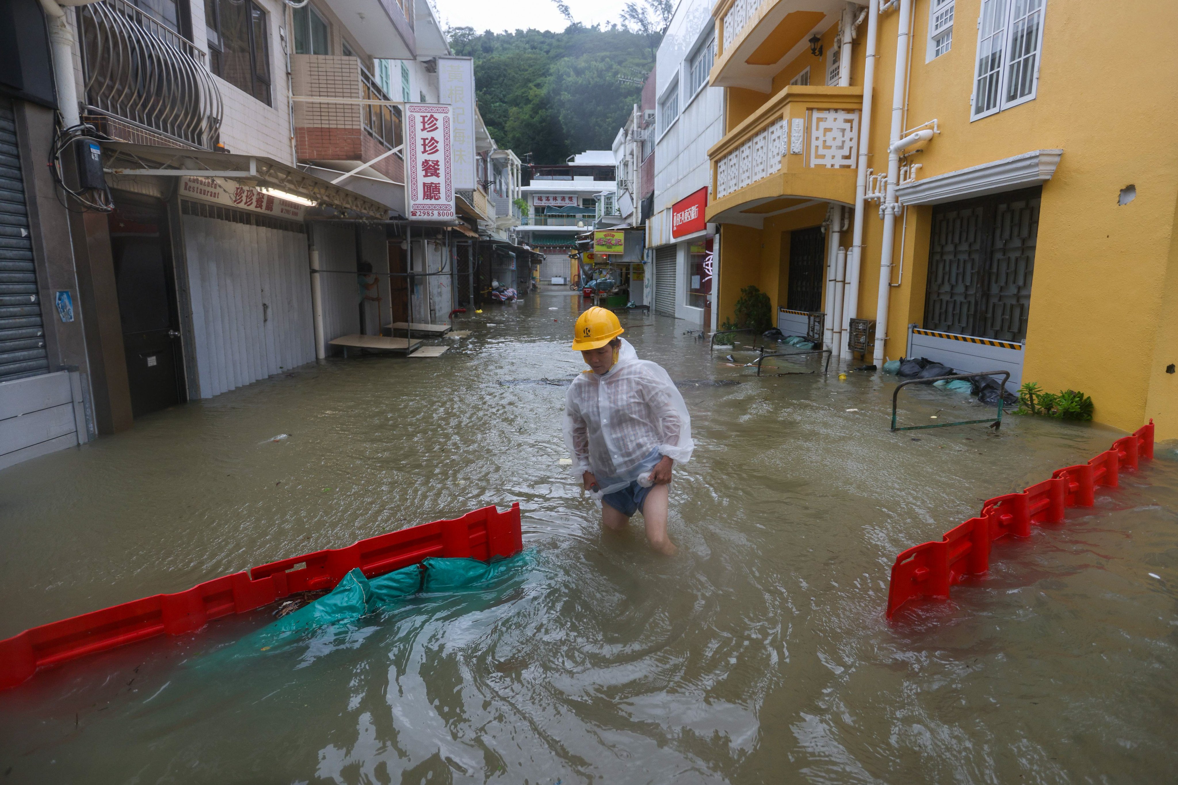 A resident wades through flooded Tai O on Lantau Island during Super Typhoon Ragasa last year. Photo: Eugene Lee