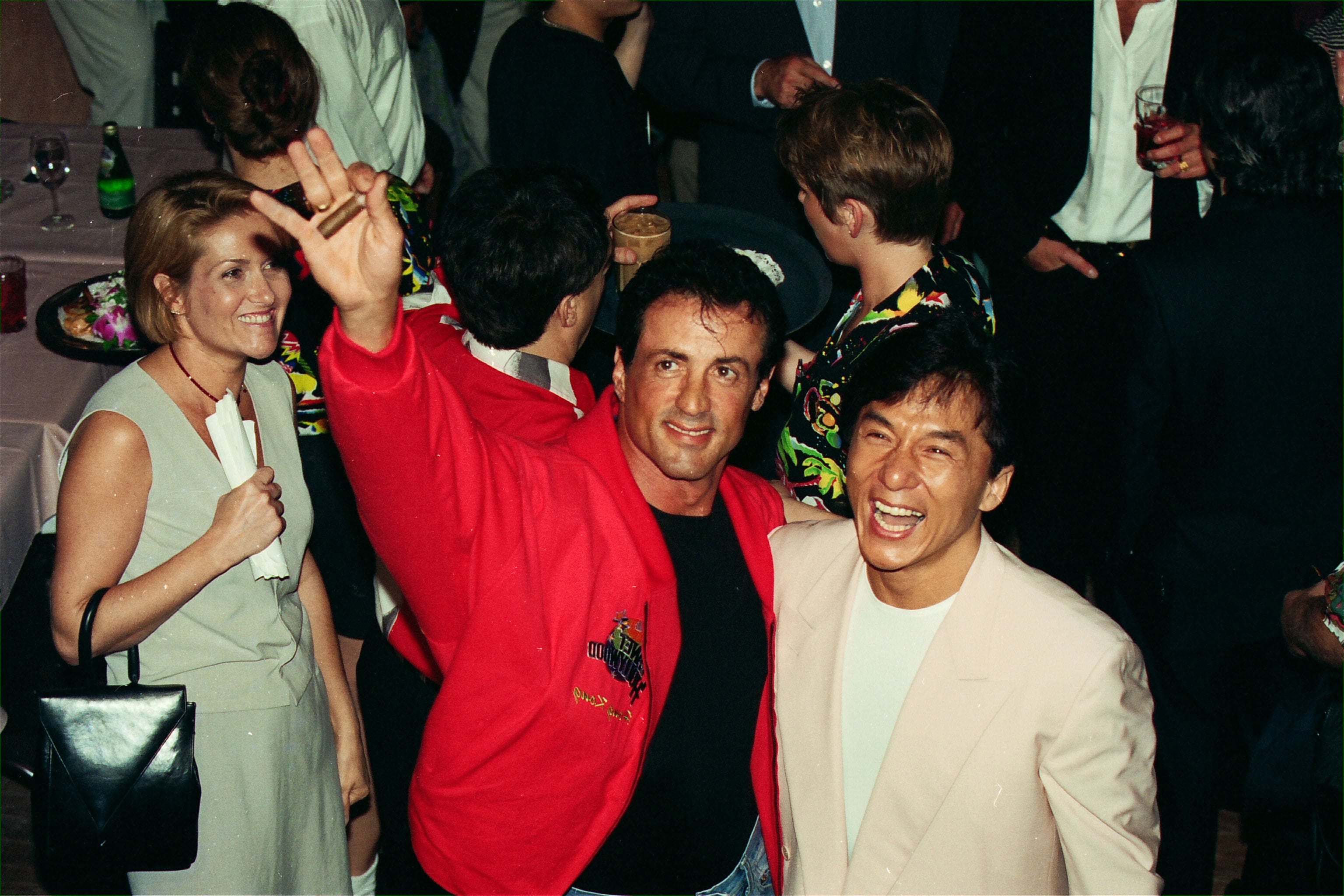 Actors Sylvester Stallone (centre) and Jackie Chan (right) arrive at the opening party of Planet Hollywood in Tsim Sha Tsui on May 29, 1994. Photo: SCMP Archive