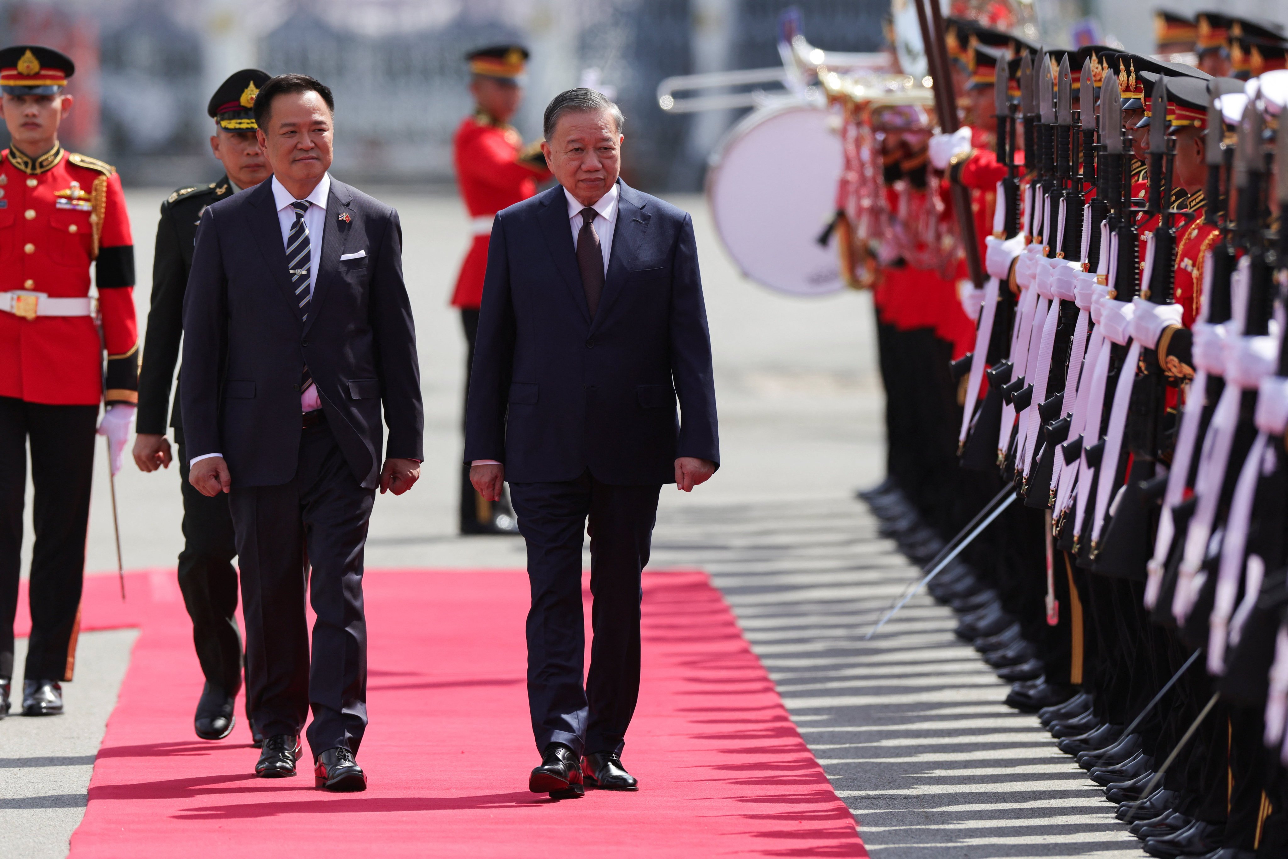 Thailand’s Prime Minister Anutin Charnvirakul (left) and Vietnam’s President To Lam review a guard of honour at Government House in Bangkok on Thursday. Photo: Reuters