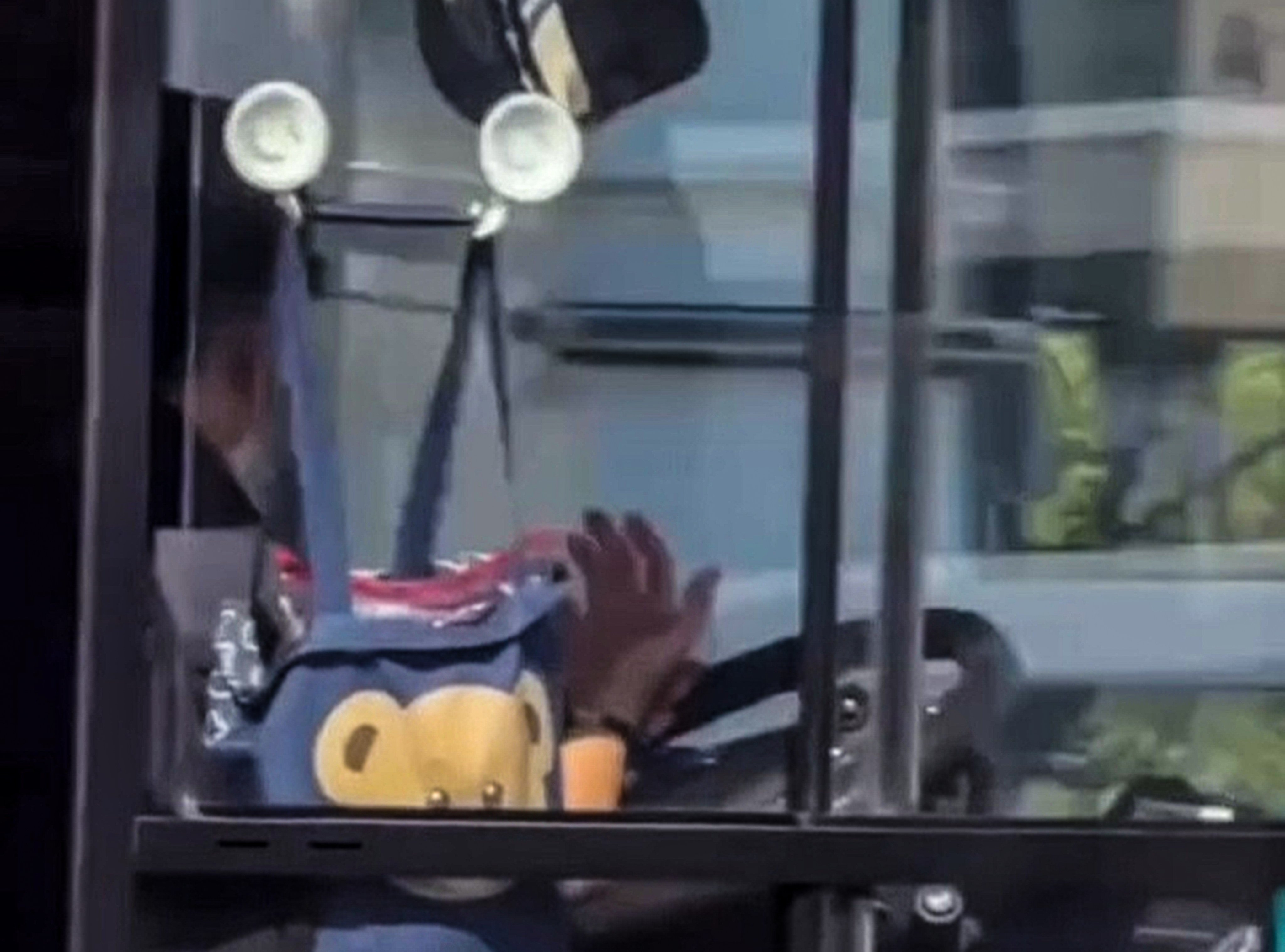 The 17-second clip shows the driver completely releasing his grip on the steering wheel while the bus is in motion. Photo: Handout