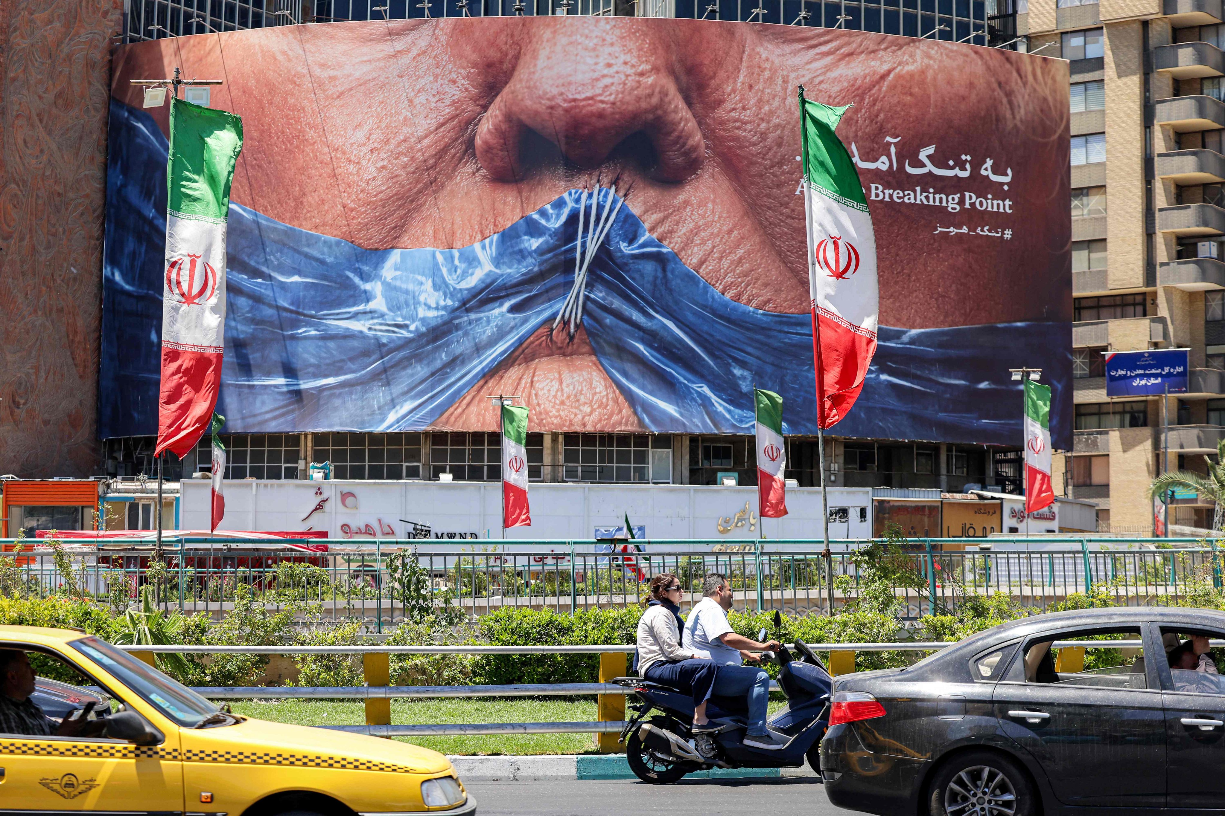 An anti-US billboard in Tehran depicting US President Donald Trump and the Strait of Hormuz. Photo: AFP