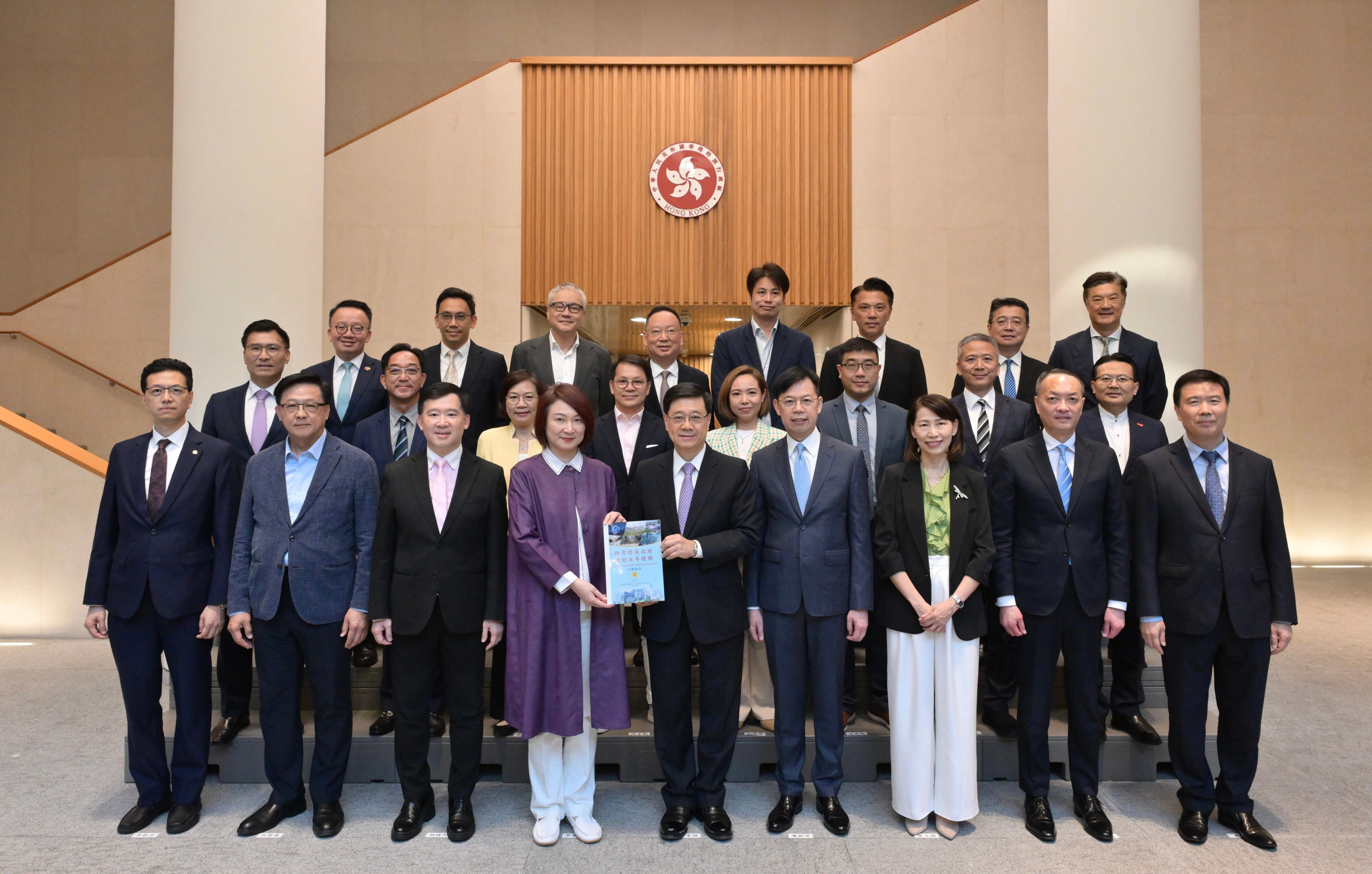 Chief Executive John Lee (front row, centre) and other officials met lawmakers on Friday morning to discuss the report. Photo: Handout