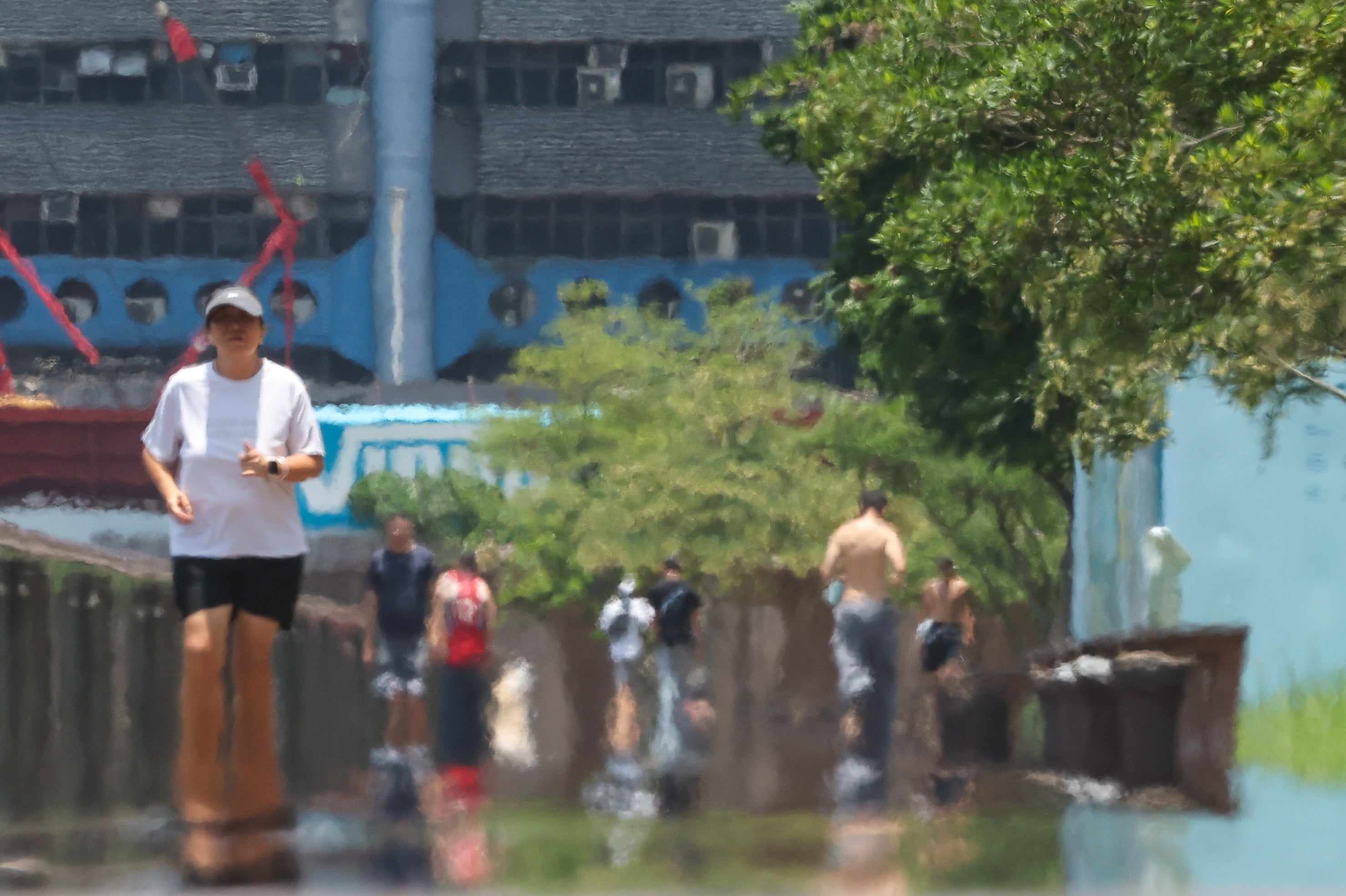Joggers on Kwun Tong Promenade on Friday. Photo:  Edmond So