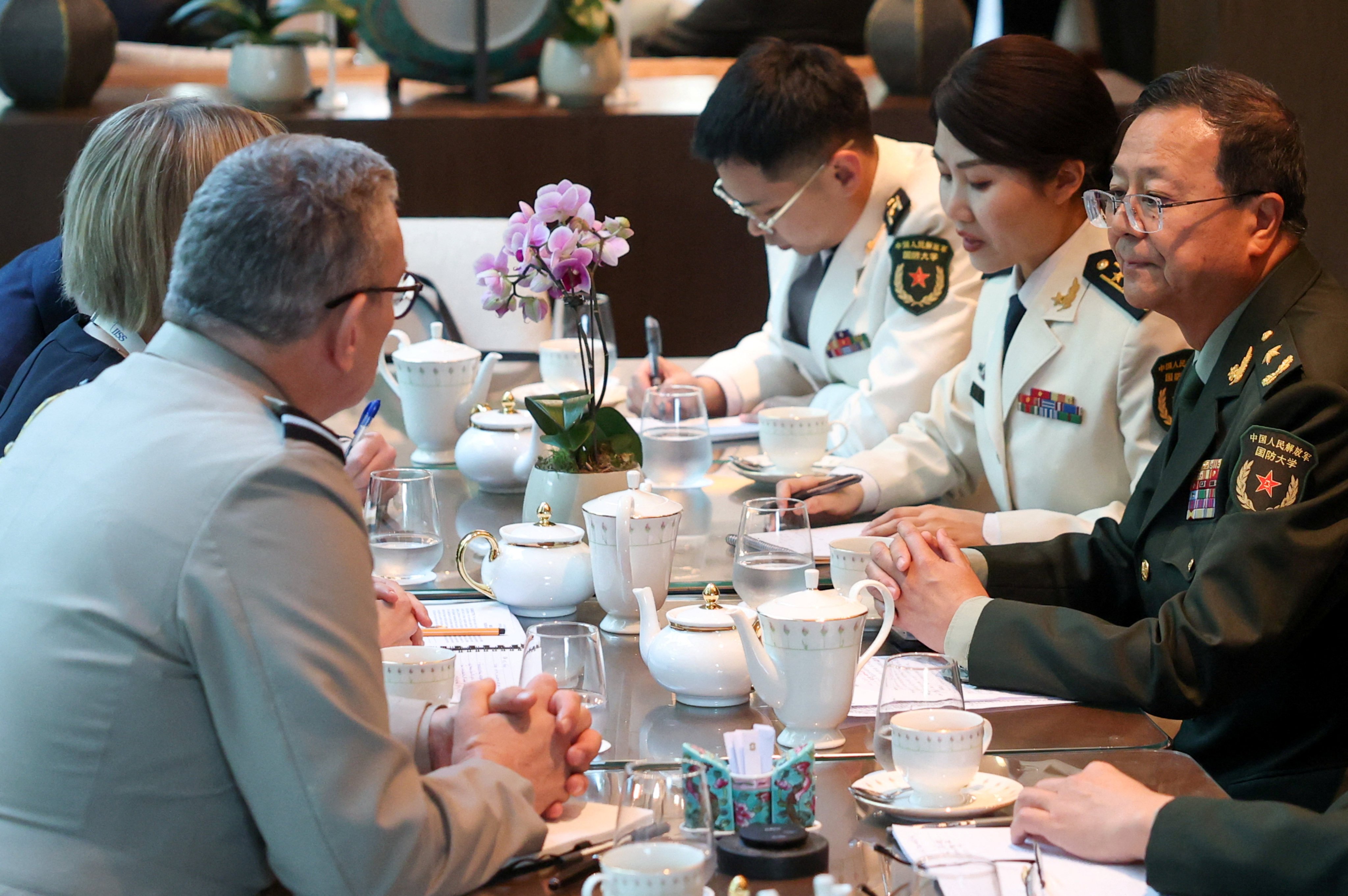 Major General Meng Xiangqing, who is leading the Chinese delegation to Asia’s largest defence summit, meets with British military officials on Friday. Photo: Reuters