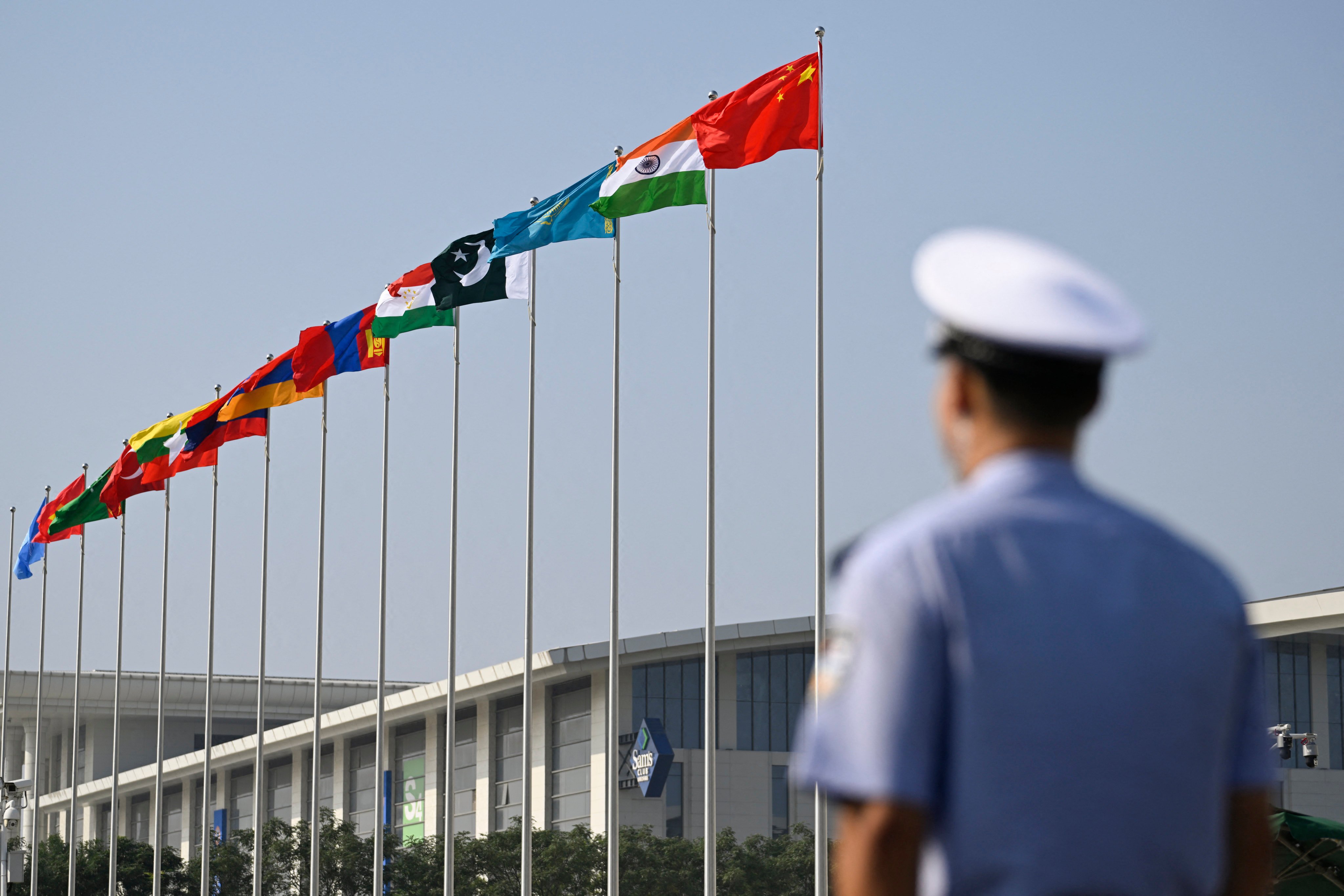 Flags wave outside the Tianjin Meijiang Convention and Exhibition Centre during the Shanghai Cooperation Organisation (SCO) Summit in Tianjin on September 1. Photo: AFP