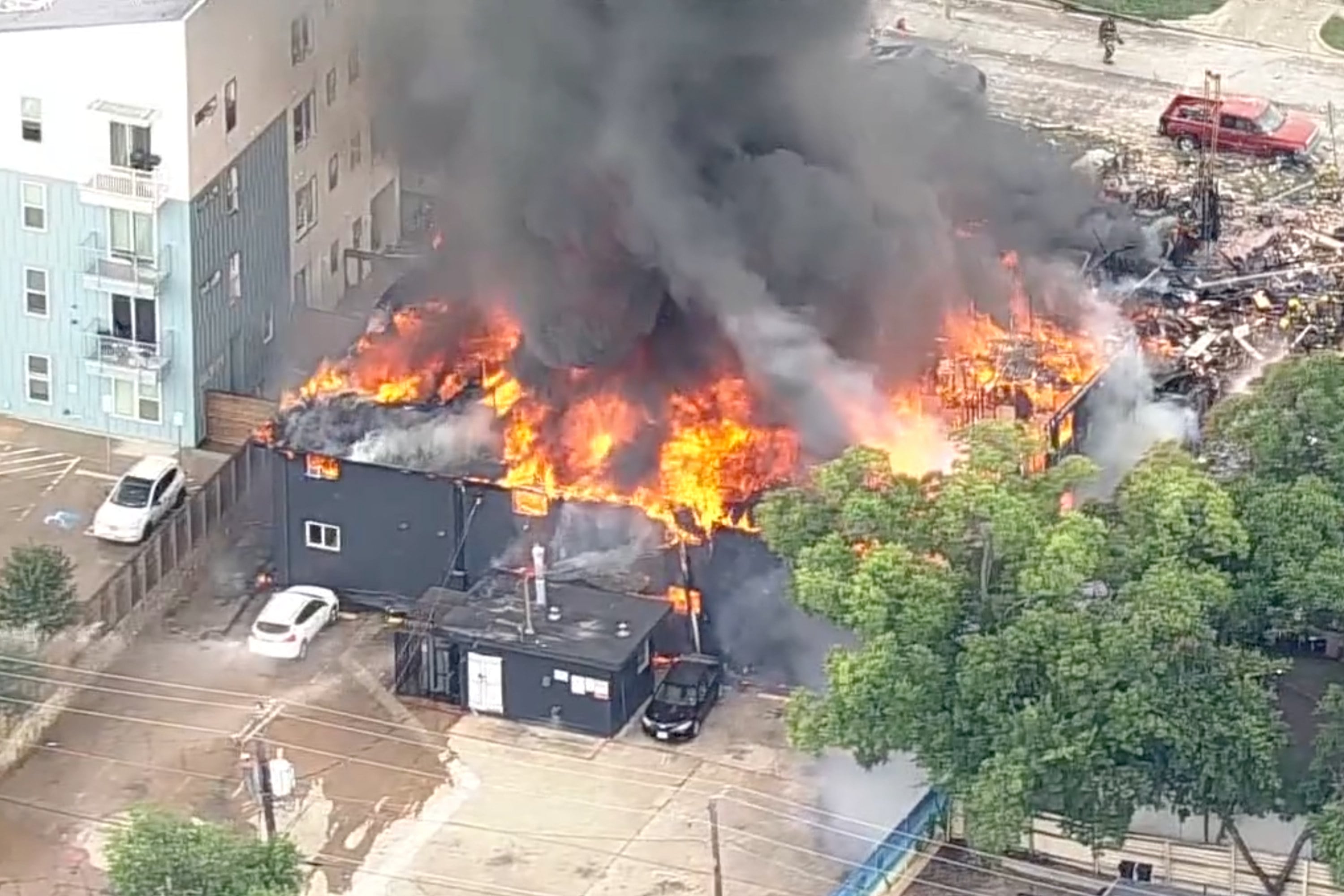 Flames engulfing the two-storey complex. Photo: KDFW FOX 4 via AP