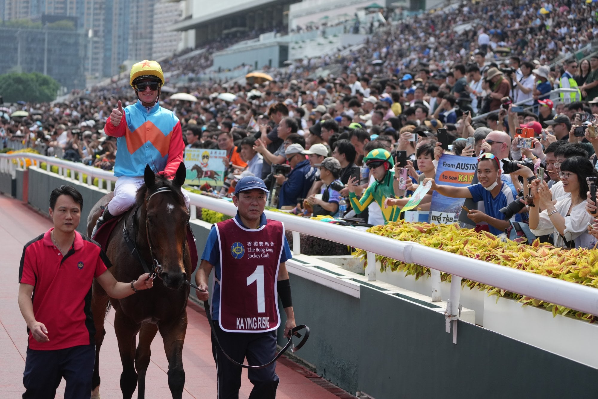 Zac Purton celebrates with horse racing enthusiasts after riding Ka Ying Rising to victory in the Group 1 Chairman’s Sprint Prize on FWD Champions Day in Sha Tin last month. Photo: Sam Tsang