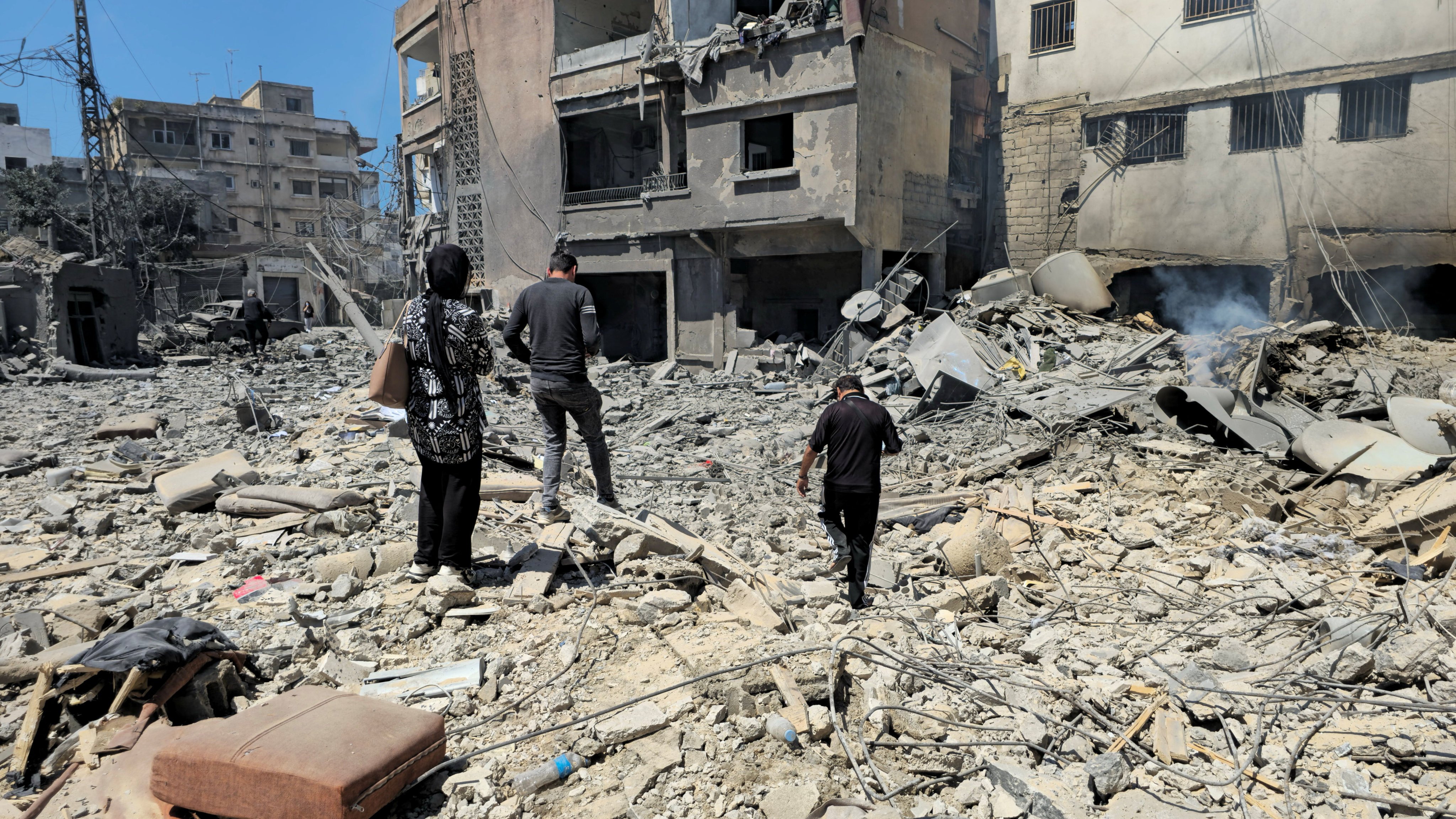People inspect the site of an Israeli strike in Tyre, Lebanon on Thursday. Photo: Reuters