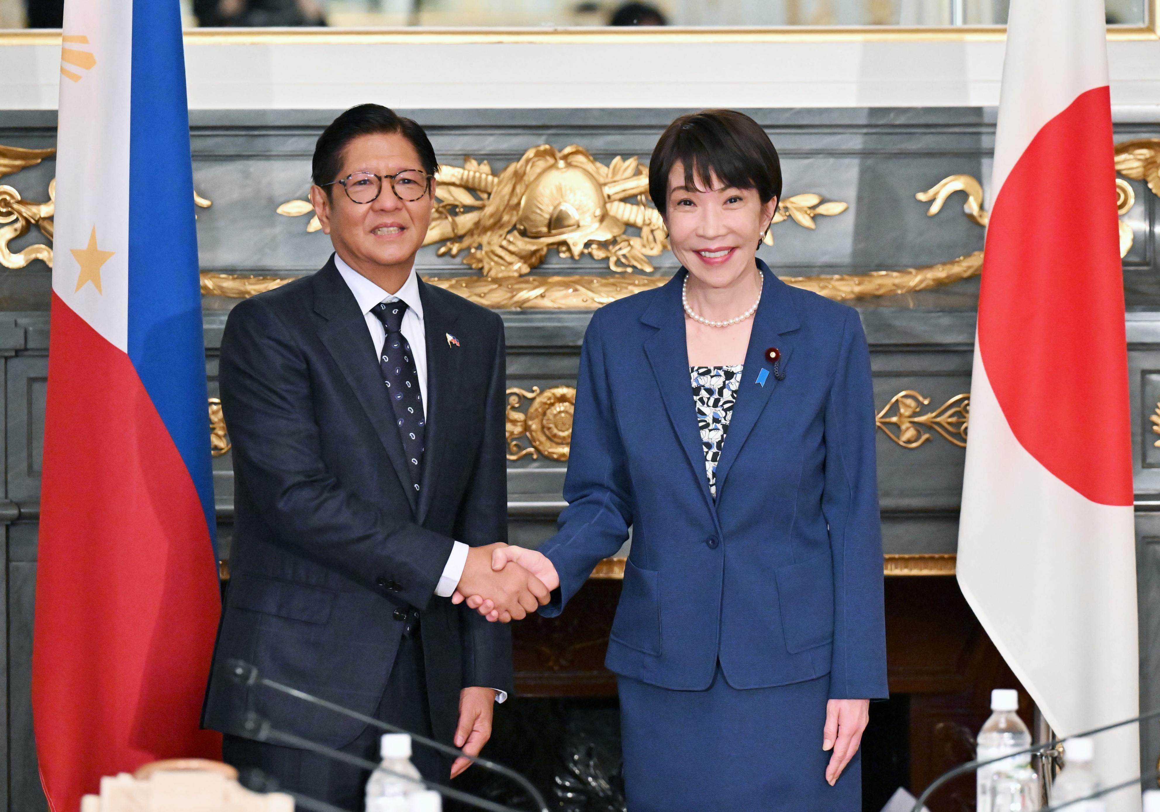 Japanese Prime Minister Sanae Takaichi (right) and Philippine President Ferdinand Marcos Jnr (left) shake hands before talks in Tokyo on May 28, 2026. Photo: Kyodo