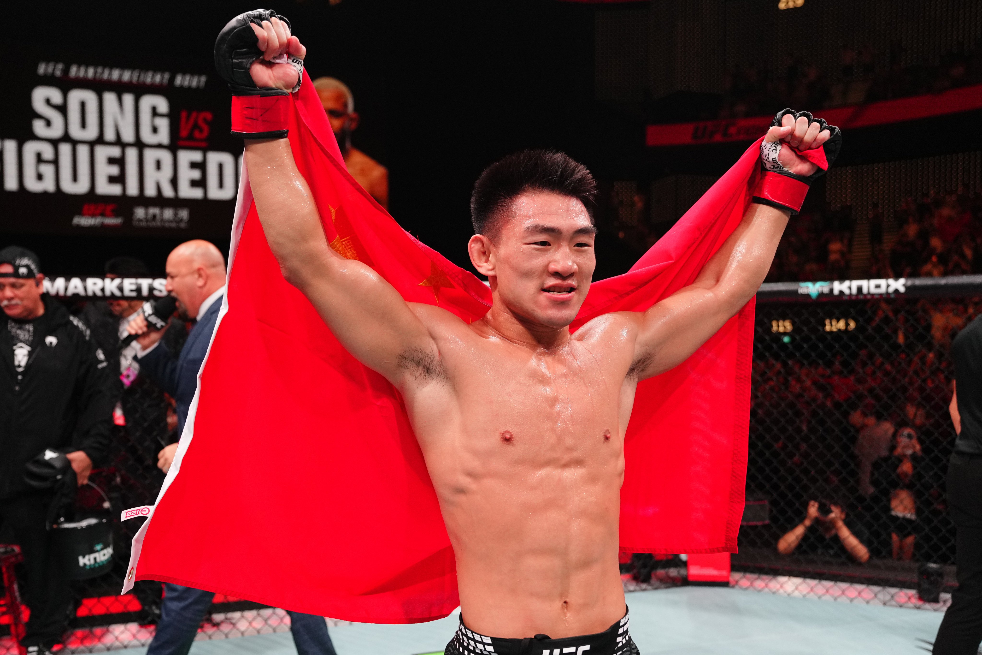 Song Yadong celebrates after beating Deiveson Figueiredo by submission in their bantamweight bout in Macau. Photo: Getty Images