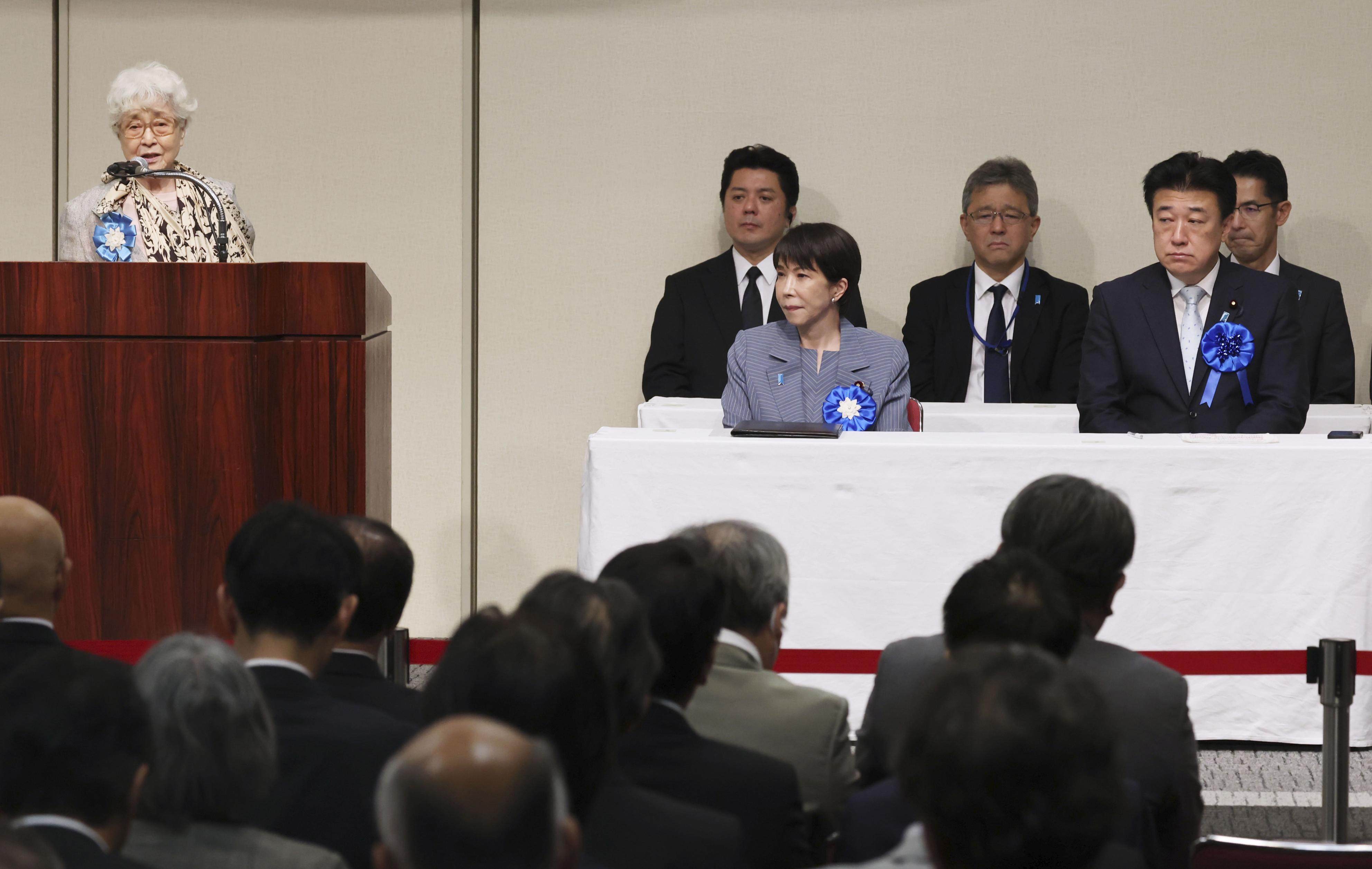 Sakie Yokota (left), whose daughter Megumi was abducted by North Korea in 1977 at age 13, speaks at a rally on the abduction issue in Tokyo on May 30, 2026, where Prime Minister Sanae Takaichi (front row, middle) also attended. Photo: Kyodo
