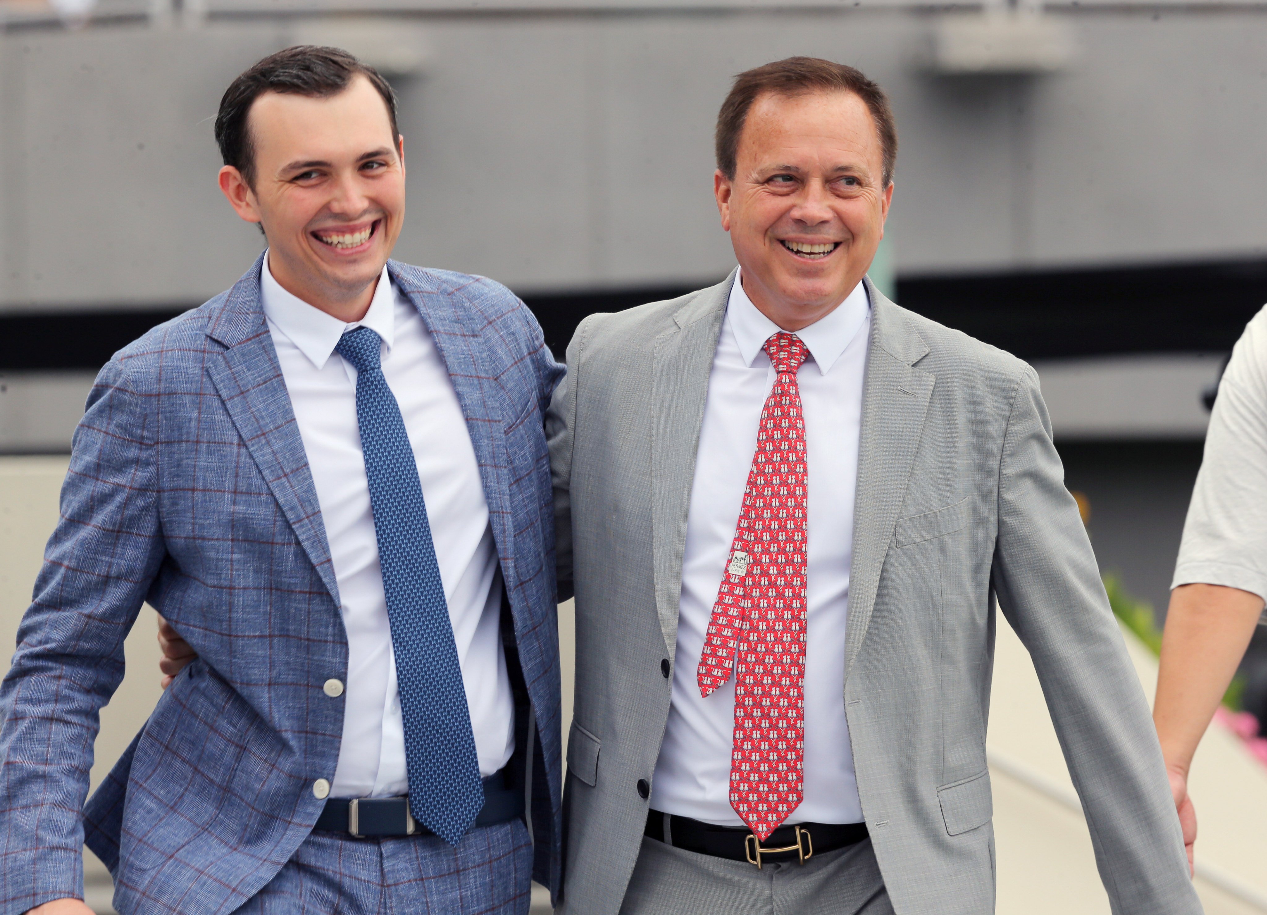 Caspar Fownes (right) and son Ronan celebrate the stable’s double at Sha Tin on Sunday. Photos: Kenneth Chan
