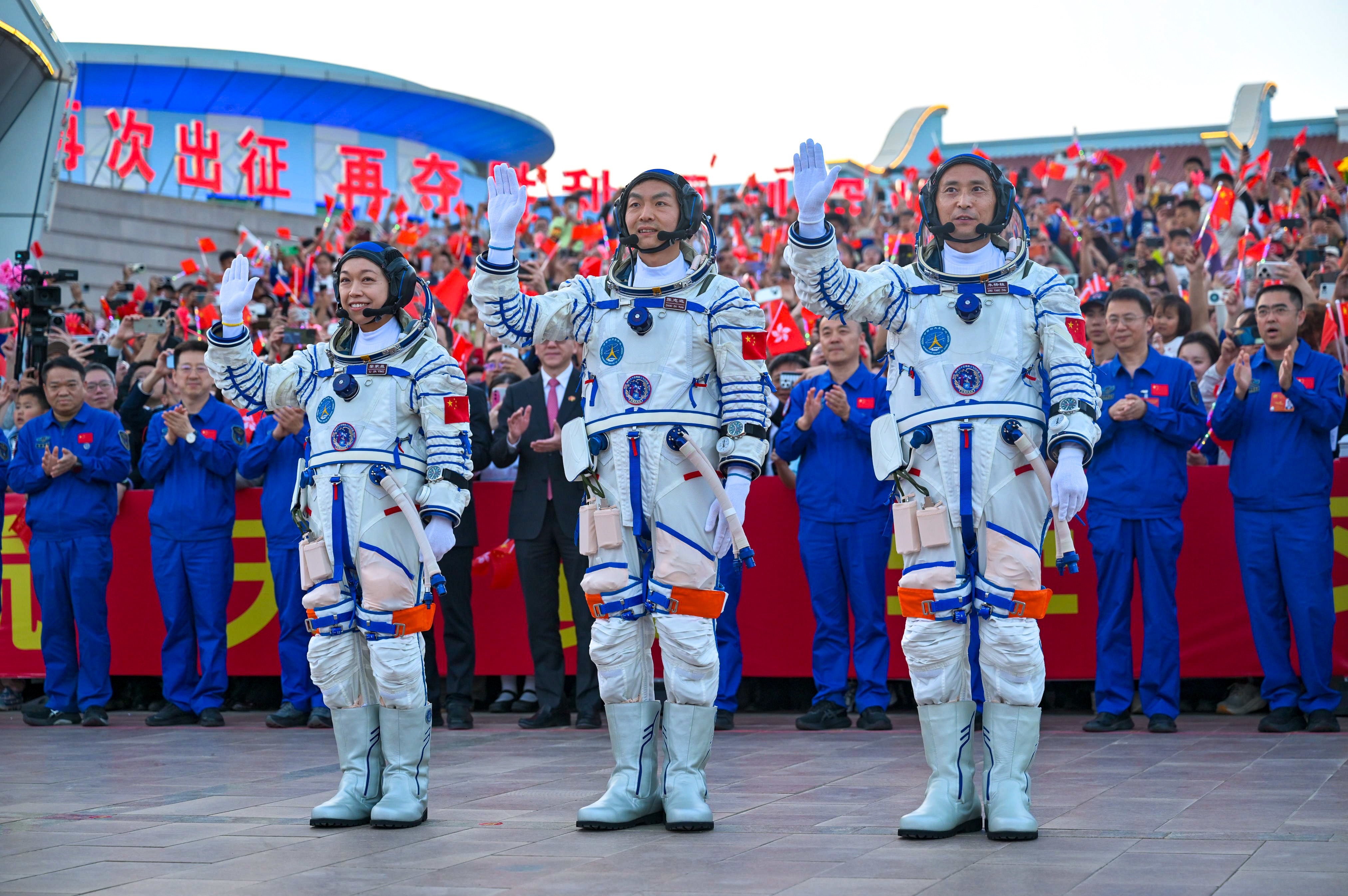 (From left) Lai Ka-ying, Zhang Zhiyuan and Zhu Yangzhu at the mission send-off ceremony at the Jiuquan Satellite Launch Centre in northwestern China. Photo: Xinhua