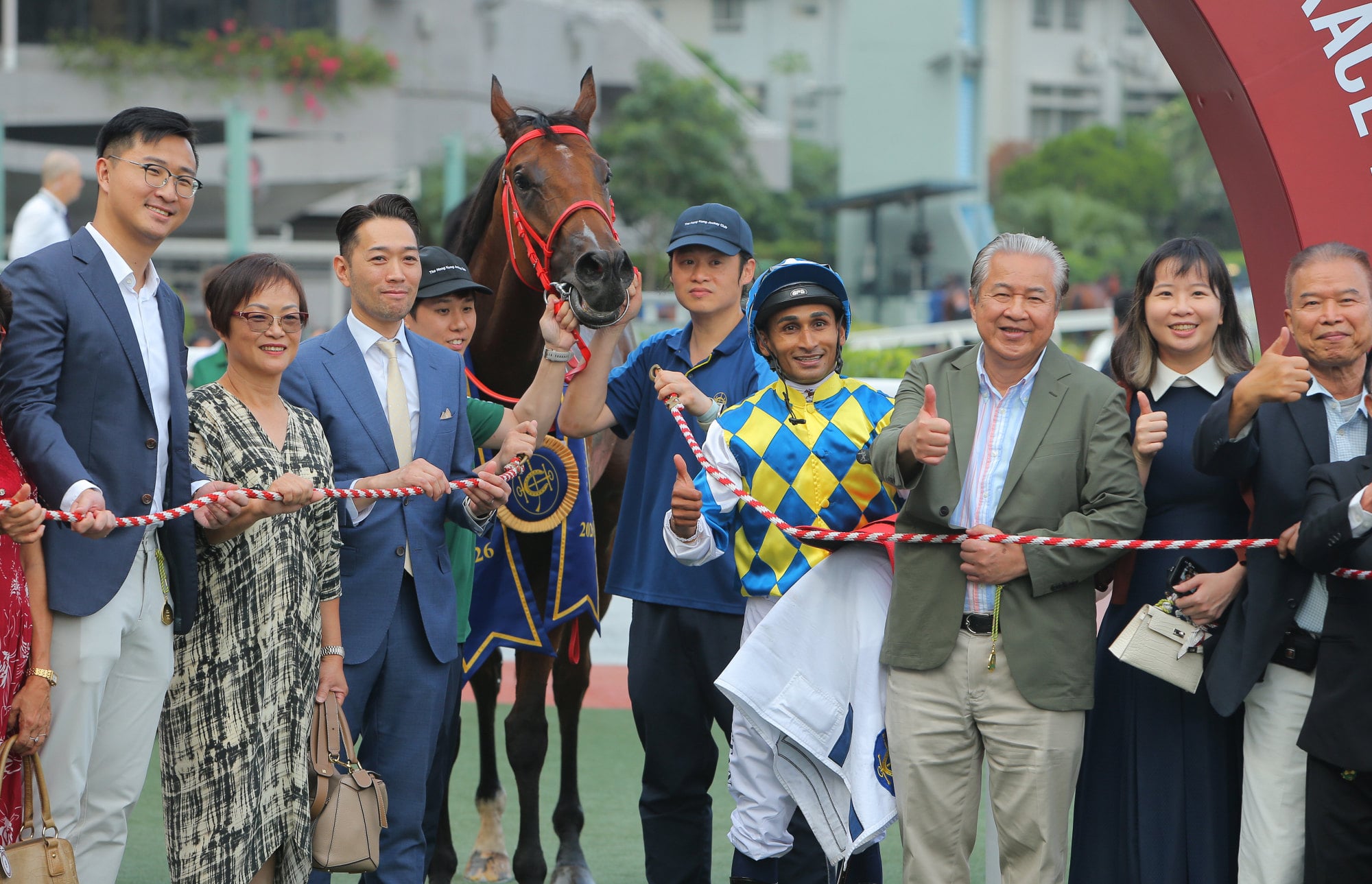 Manfred Man’s assistant trainer Wing Ip-hang (third left) and connections of Patch Of Stars celebrate his win.