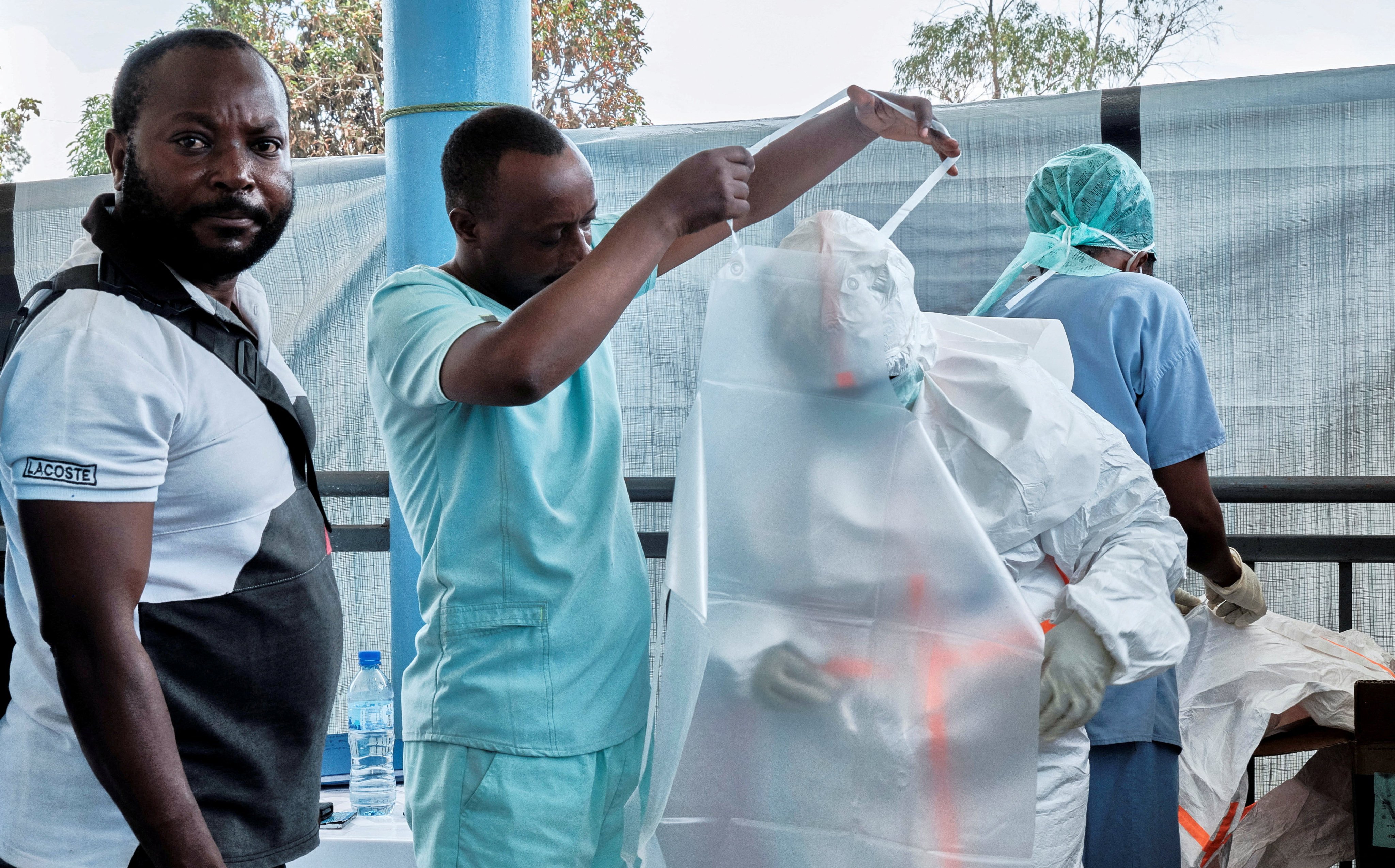 Medical workers from the Alliance for International Medical Action don personal protective equipment as they set up a treatment centre for the Ebola response in Rwampara, DR Congo, on Friday. Photo: Reuters