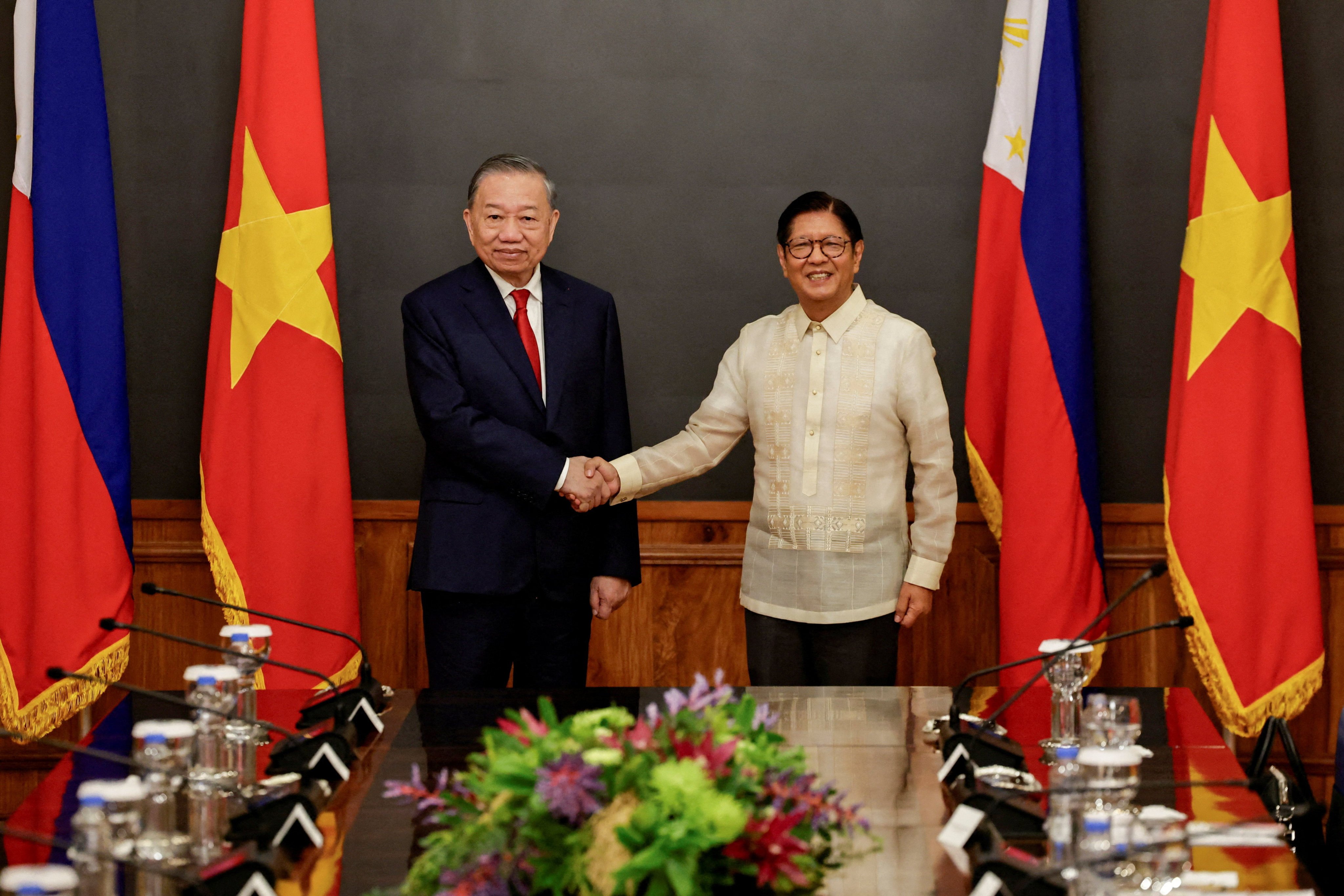 Philippine President Ferdinand Marcos Jnr (right) and Vietnam’s President To Lam shake hands at the Malacanang presidential palace in Manila on Monday. Photo: Reuters