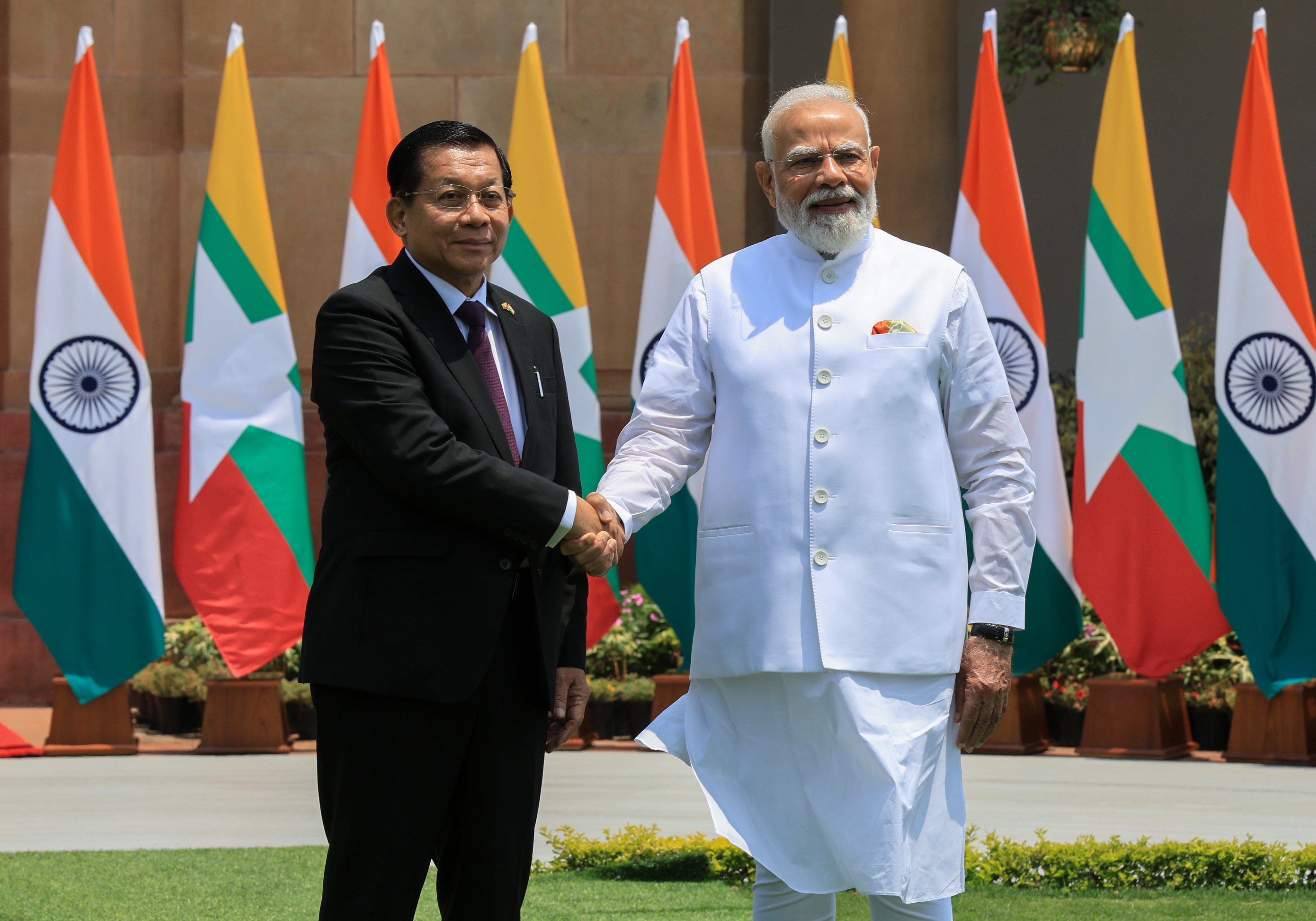 Indian Prime Minister of India Narendra Modi (right) shakes hands with Myanmar President Min Aung Hlaing before their meeting at Hyderabad House in New Delhi, India, on Monday. Photo: EPA