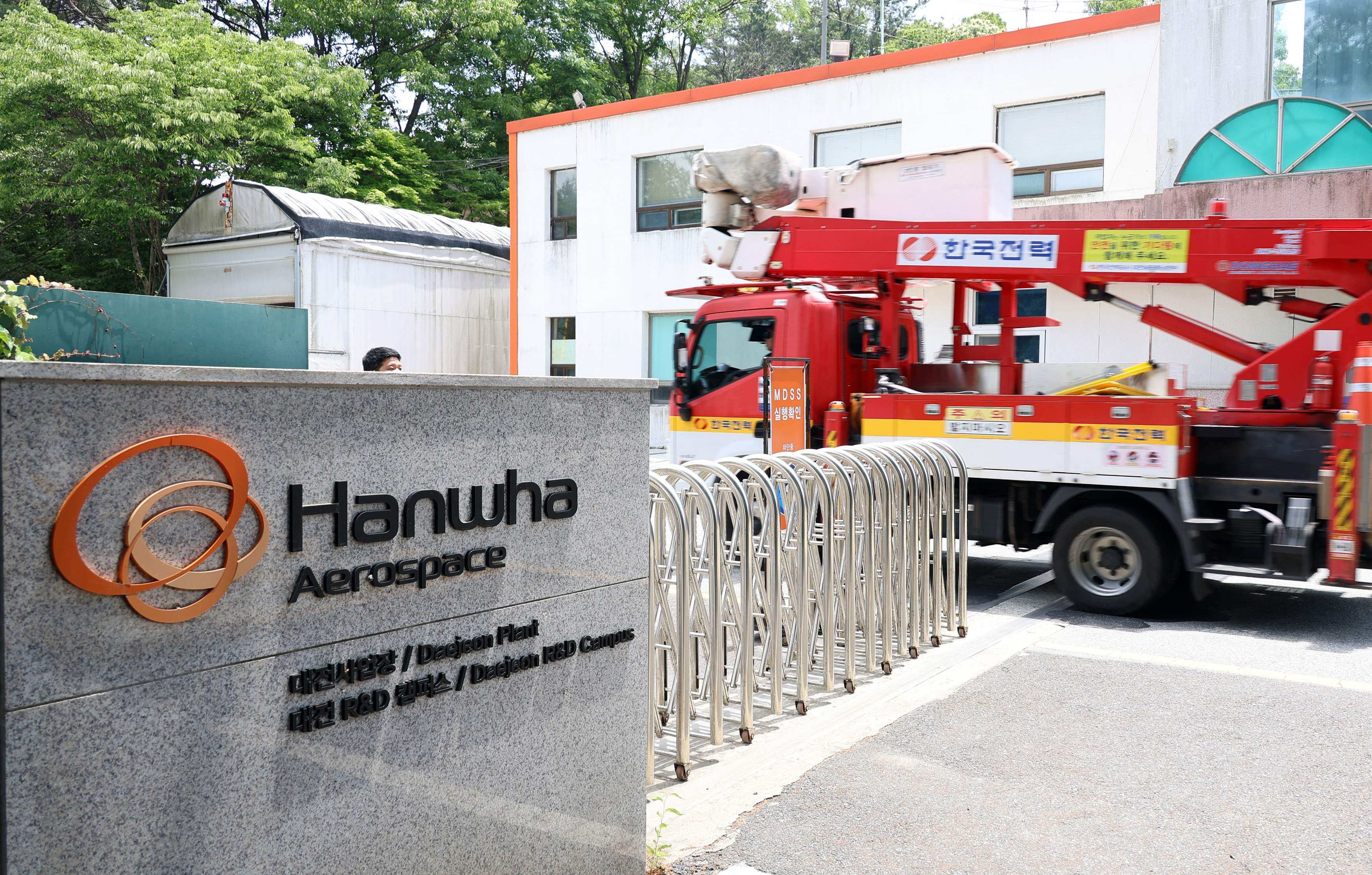 A firefighting vehicle enters the main gate at the Hanwha Aerospace plant in Daejeon, South Korea, on Monday. Photo: Yonhap/AFP