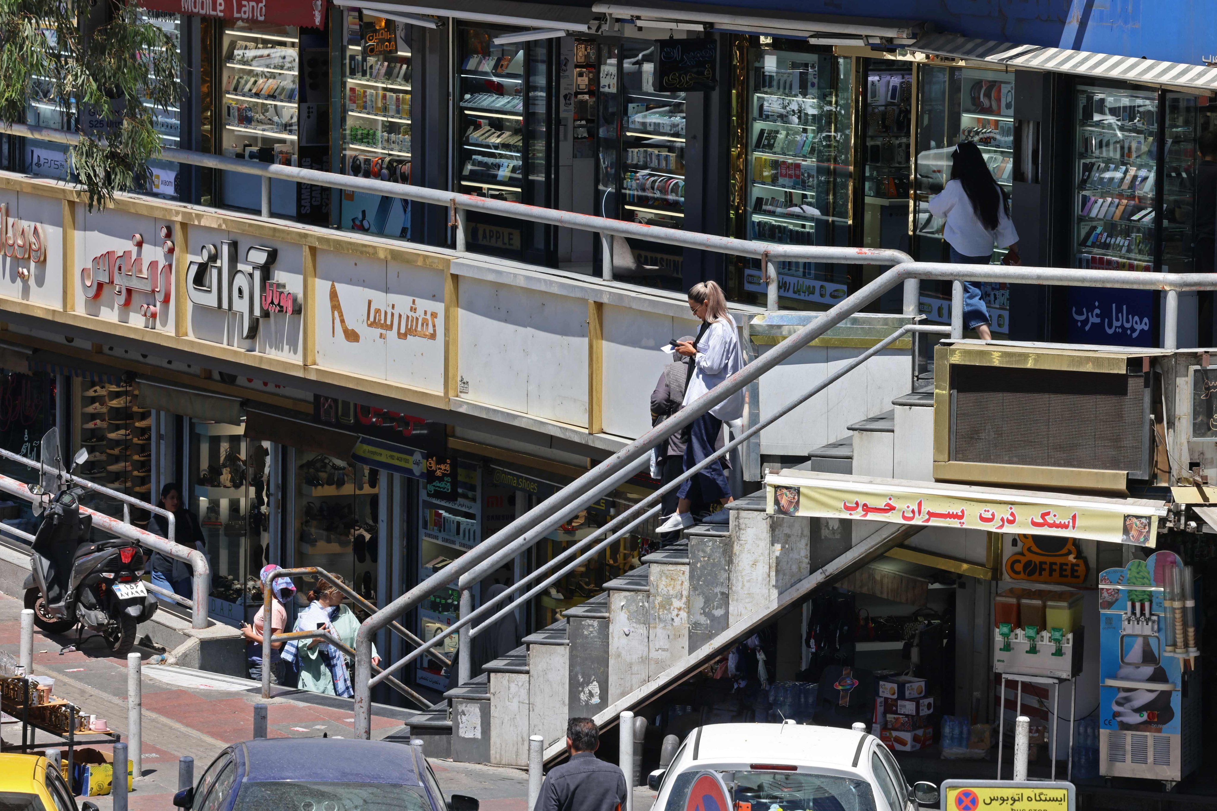 Life goes on around a shopping arcade in Tehran on May 31. Washington’s strategy rests on a Western fantasy: that a heavily sanctioned authoritarian state will simply collapse quietly. History says otherwise. Photo: AFP