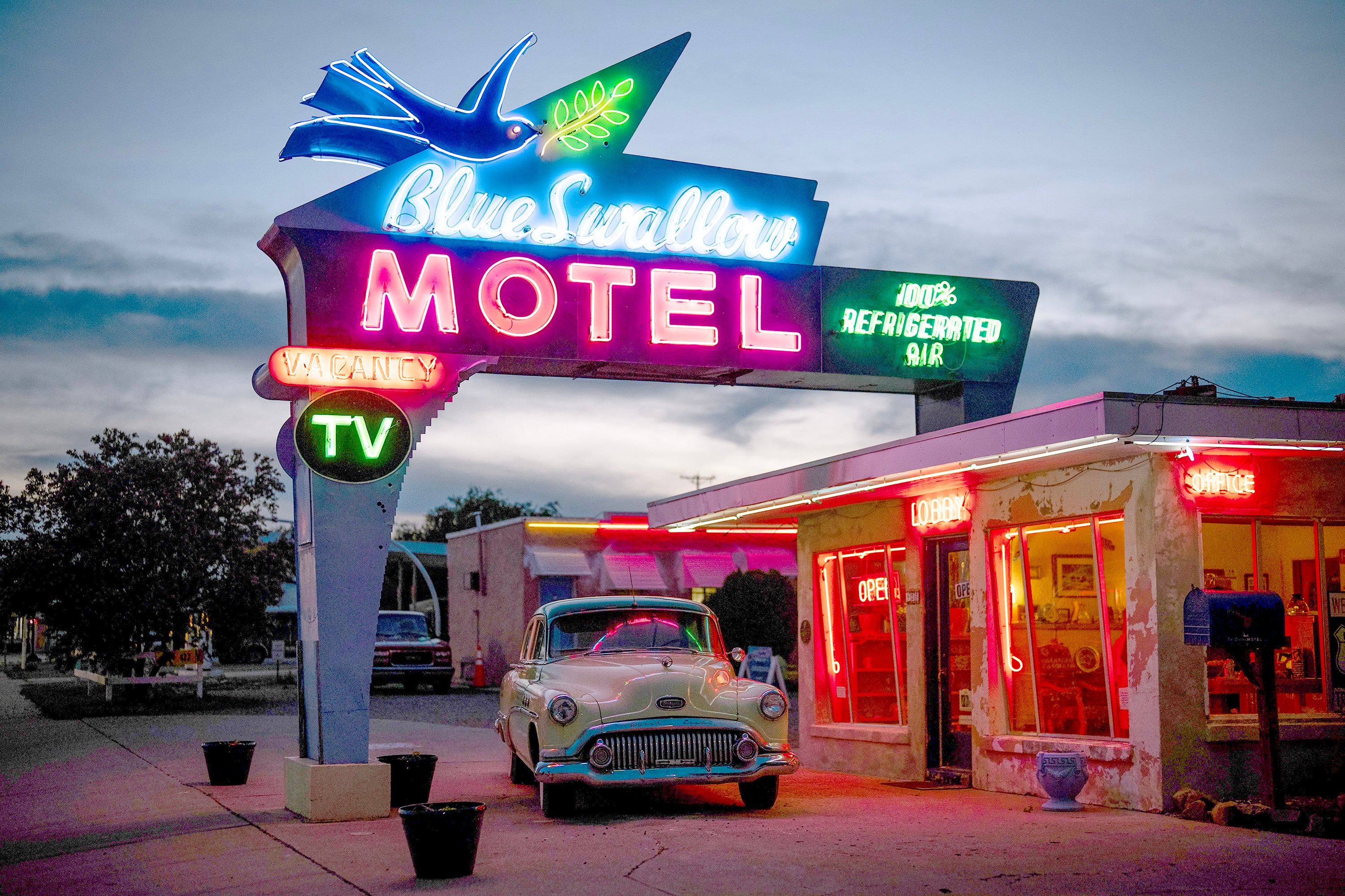 A vintage Buick parks outside the 86-year-old Blue Swallow Motel on Route 66 in Tucumcari, New Mexico. Photo: TNS