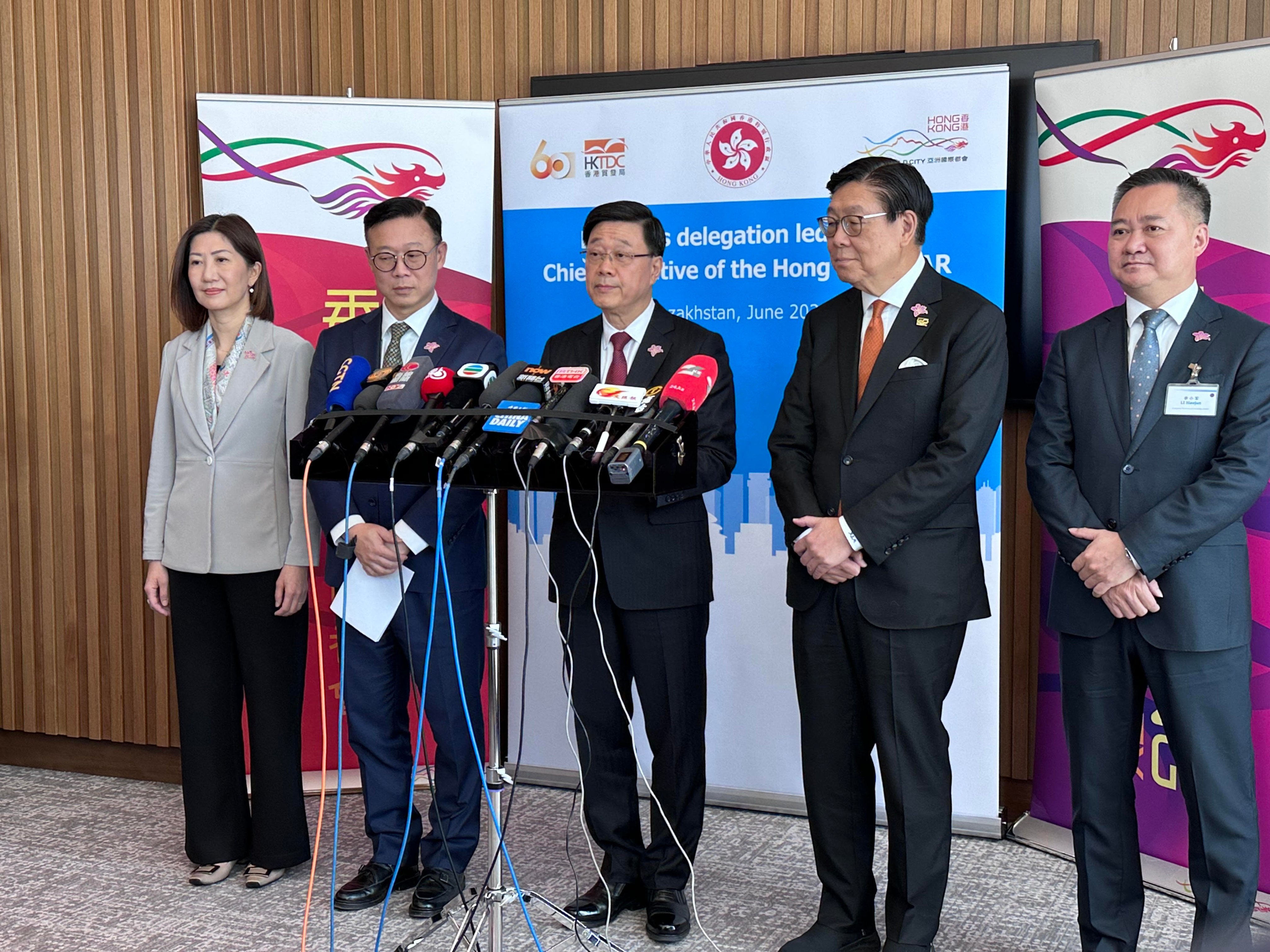 Chief Executive John Lee (centre) has said his team aims to seal as many as 43 wide-ranging partnership agreements with different organisations in Kazakhstan. Photo: Jeffie Lam