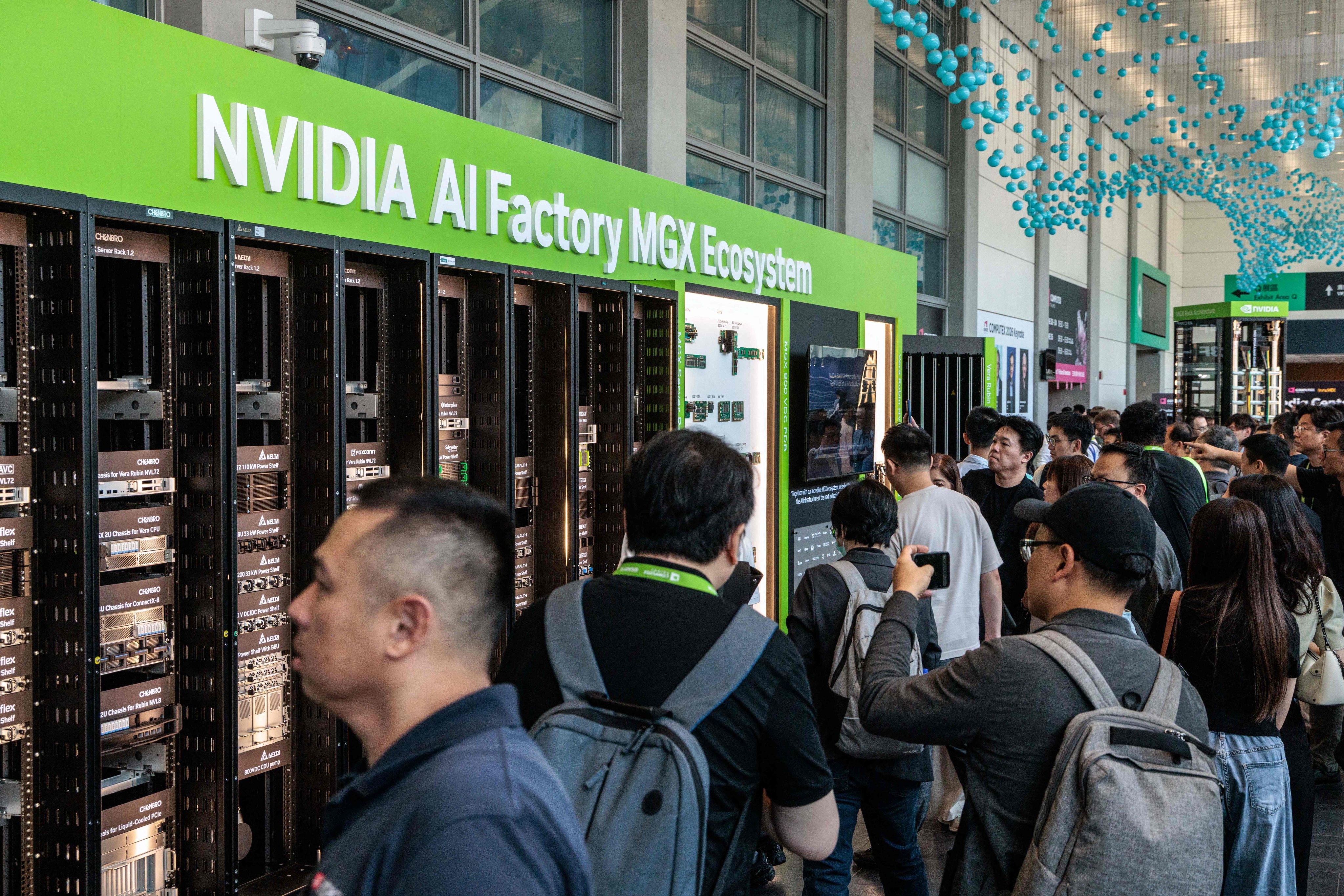 Visitors view Nvidia’s AI Factory MGX Ecosystem display during Computex in Taipei on Tuesday. Photo: AFP