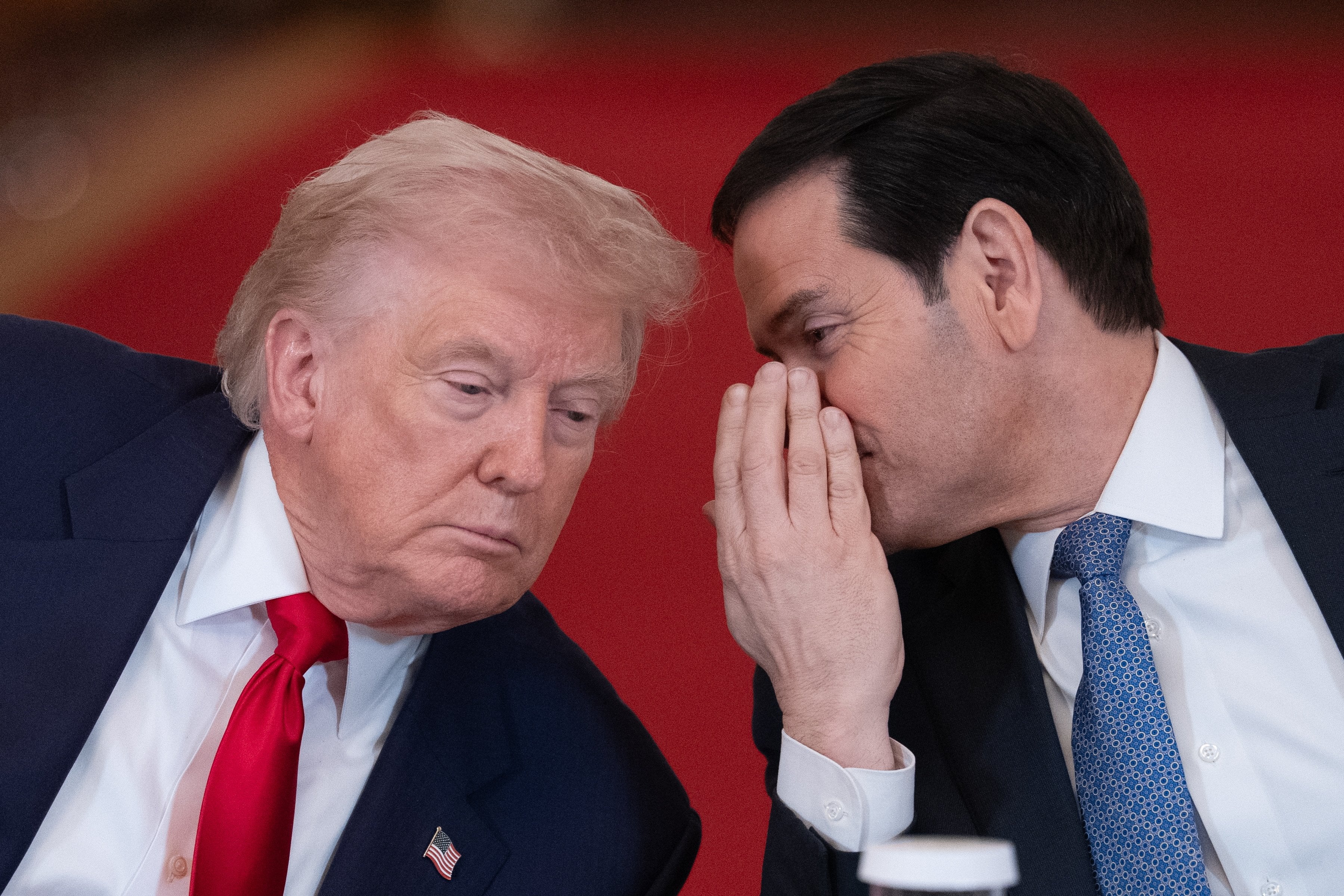 US President Donald Trump listens to US Secretary of State Marco Rubio. Photo: EPA