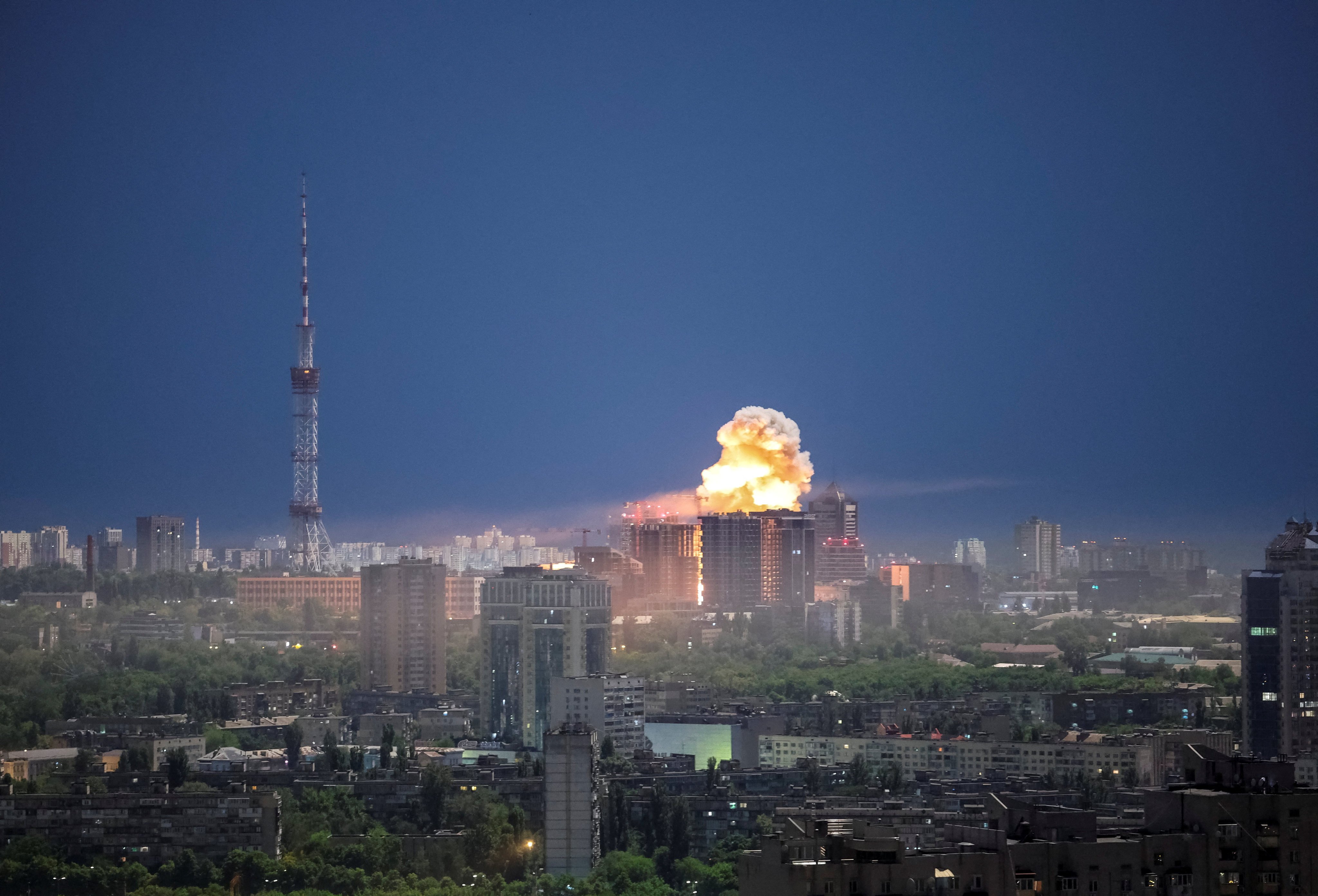 An explosion lights up the sky in Kyiv. Photo: Reuters