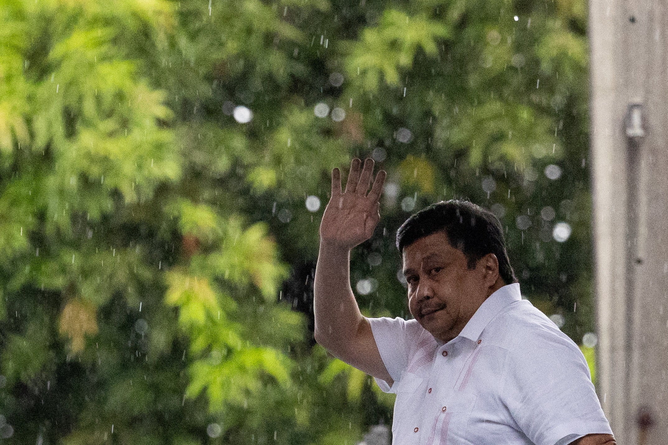 Philippine Senator Jose "Jinggoy" ⁠Estrada waves at the Philippine National Police headquarters after surrendering to the police over a graft case, in Quezon City, Philippines, June 1, 2026. REUTERS/Eloisa Lopez