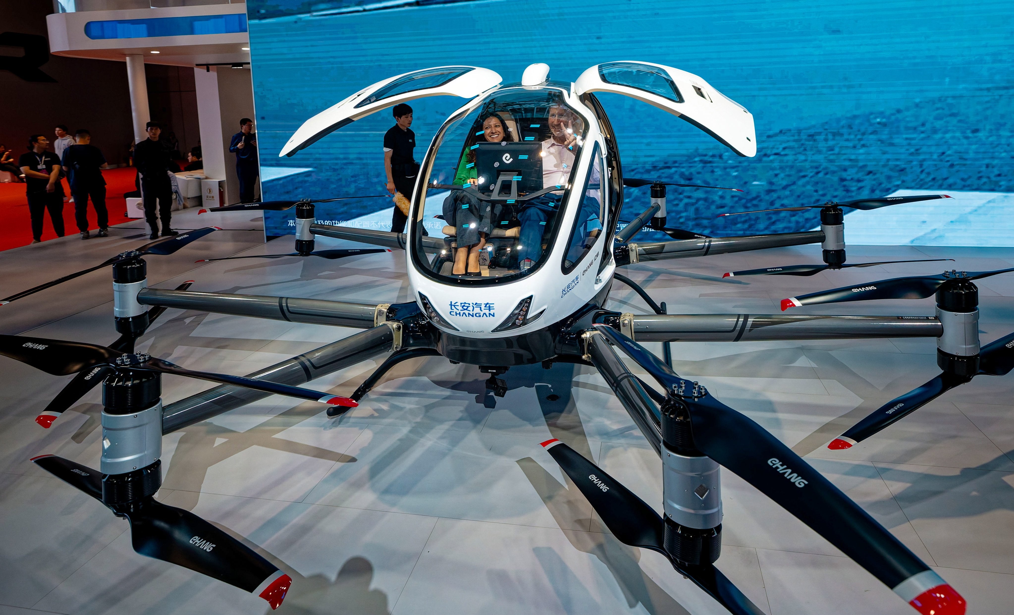 People sit inside a Changan aerial vehicle at an auto show in Shanghai. Photo: EPA-EFE