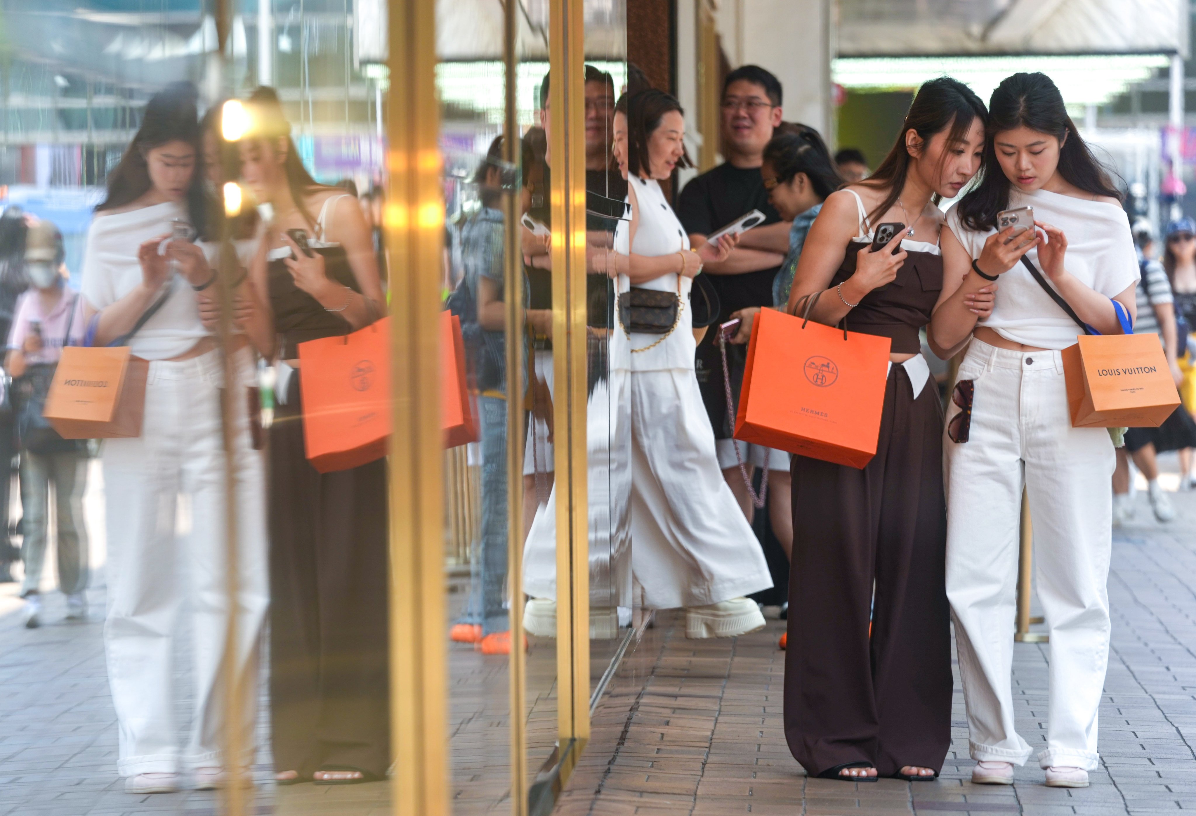 People shopping at Canton Road, an upscale retail strip in Tsim Sha Tsui. Photo: Jelly Tse