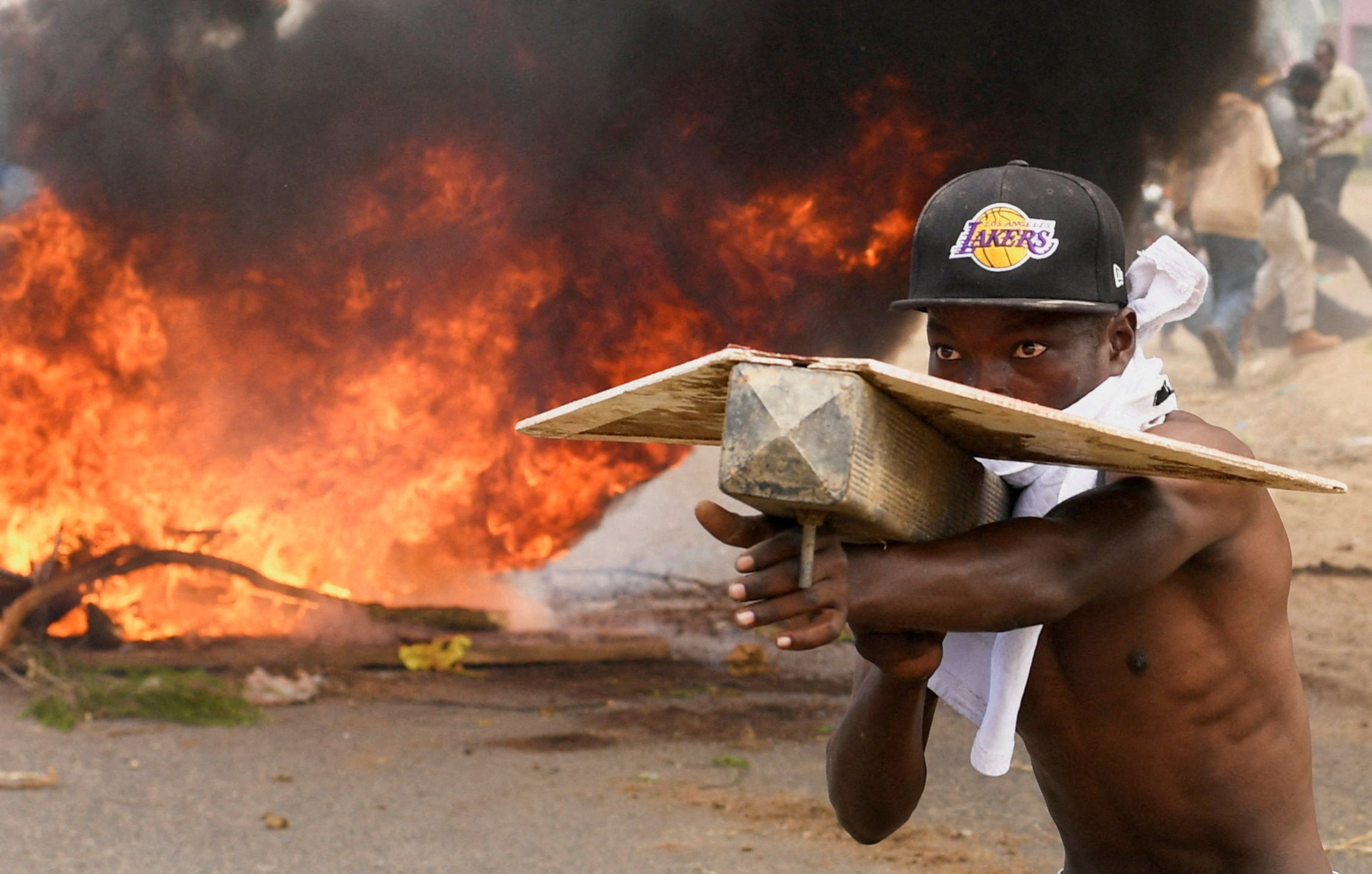 A man takes part in a protest on Monday against a US-backed Ebola quarantine plan on the establishment of a 50-bed facility at a Kenyan air force base that was intended to host Americans exposed to Ebola, in Nanyuki town, in Laikipia County. Photo: Reuters