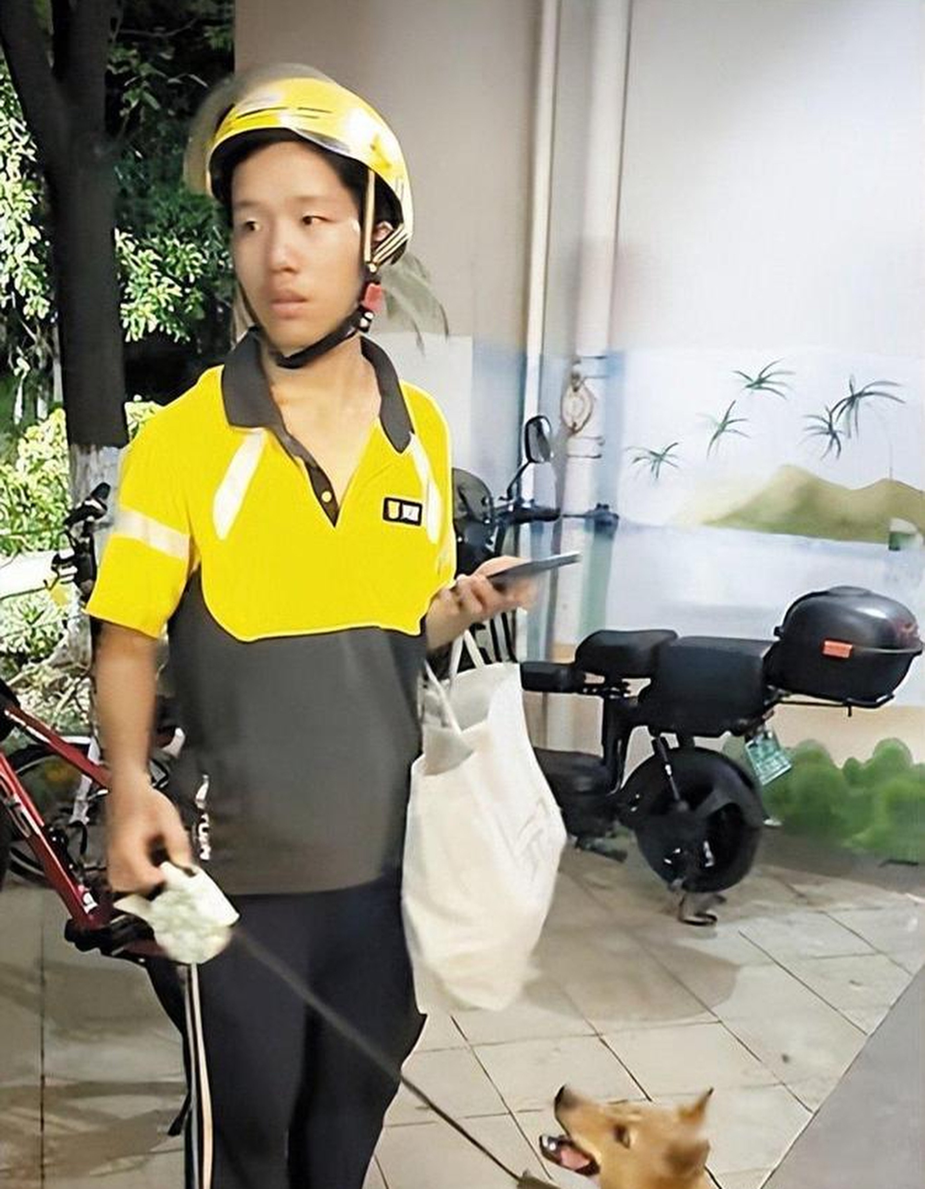 A 19-year-old man from Hunan moved to Changsha to deliver food while saving for technical school. Living under a bridge with his pet dog, he works long hours and has minimal belongings. Photo: Handout