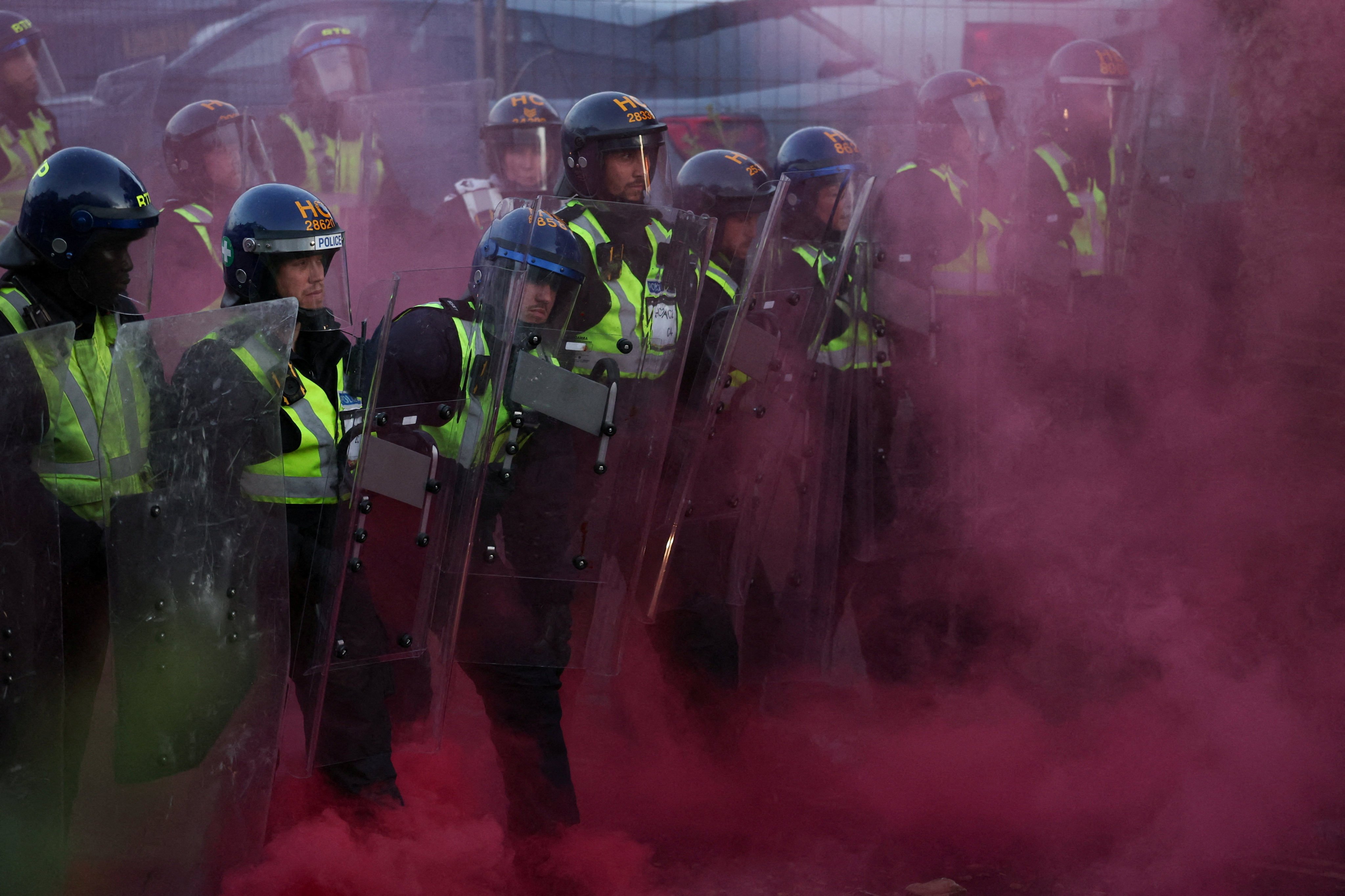 Police confront demonstrators in Southampton amid outrage over the case of handcuffed student Henry Nowak. Photo: Reuters