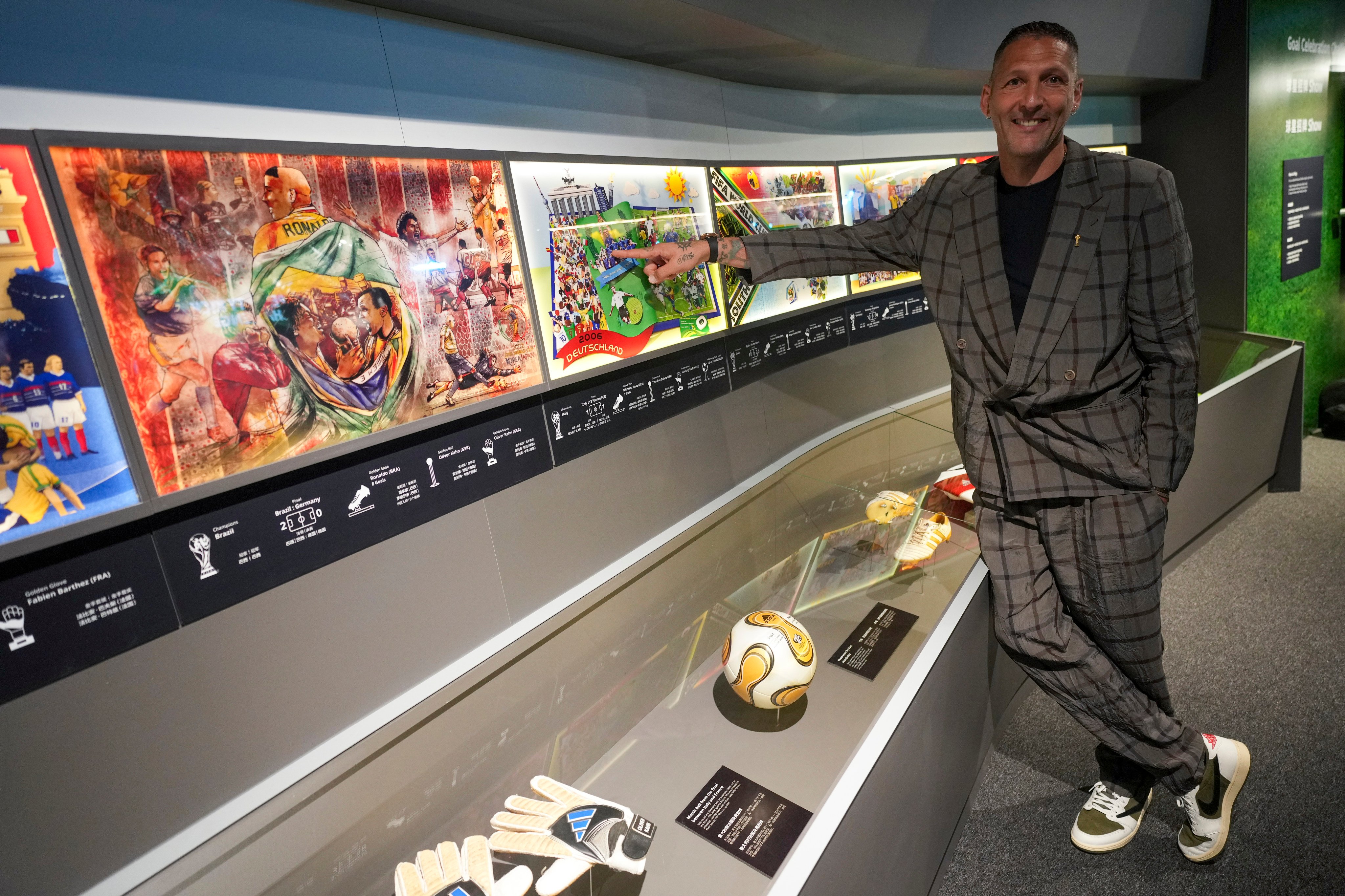 Marco Materazzi stands beside the match ball from the 2006 World Cup final during his visit to the Fifa Museum in Hong Kong. Photo: Sam Tsang.