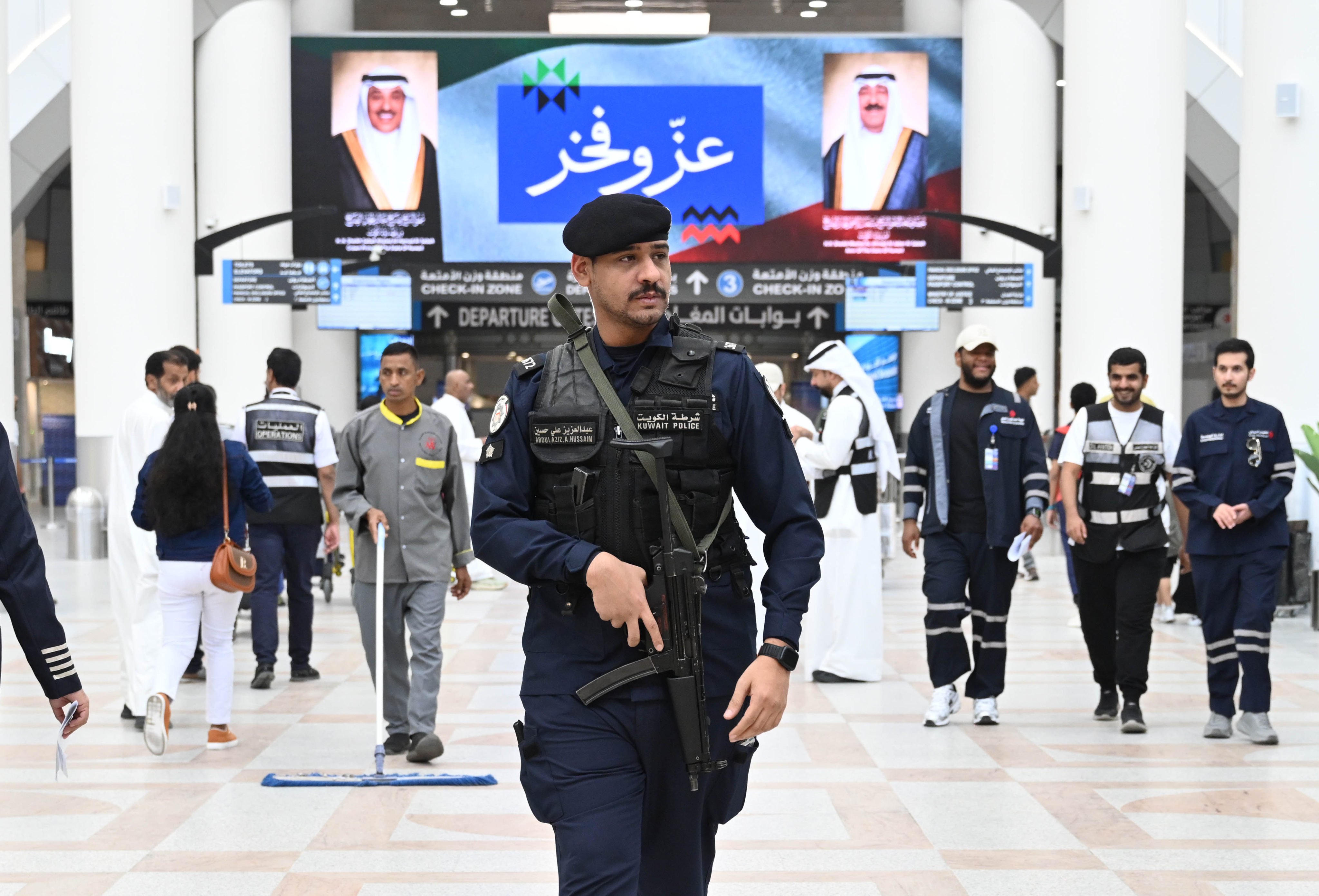 A police officer patrols Terminal 1 at Kuwait International Airport on Monday. Authorities suspended flights on Wednesday. Photo: Xinhua
