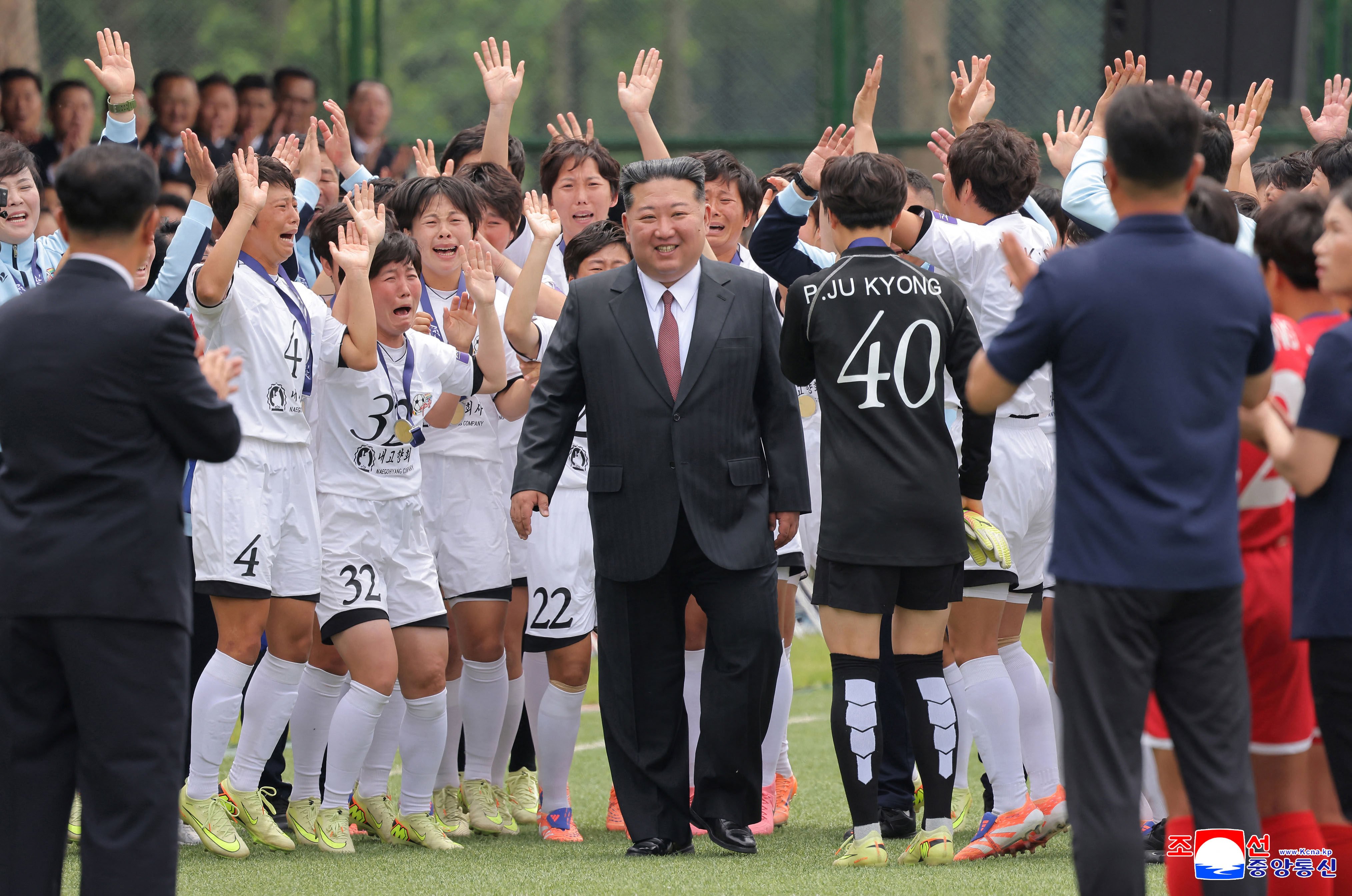North Korean leader Kim Jong-un congratulates the football players who won the AFC Under-17 Women’s Asian Cup in Pyongyang on Monday. Photo: KCNA/KNS/AFP