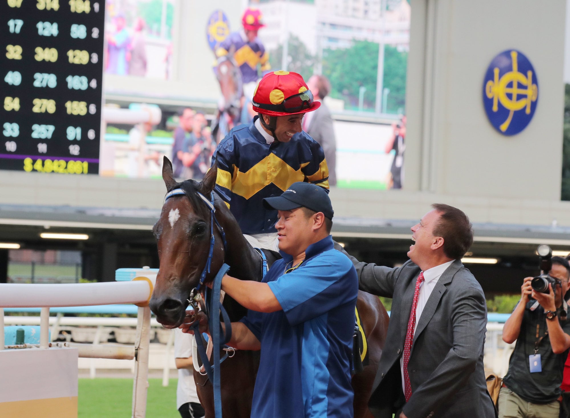 Joao Moreira and Caspar Fownes celebrate the win of Family Fortune at Happy Valley.
