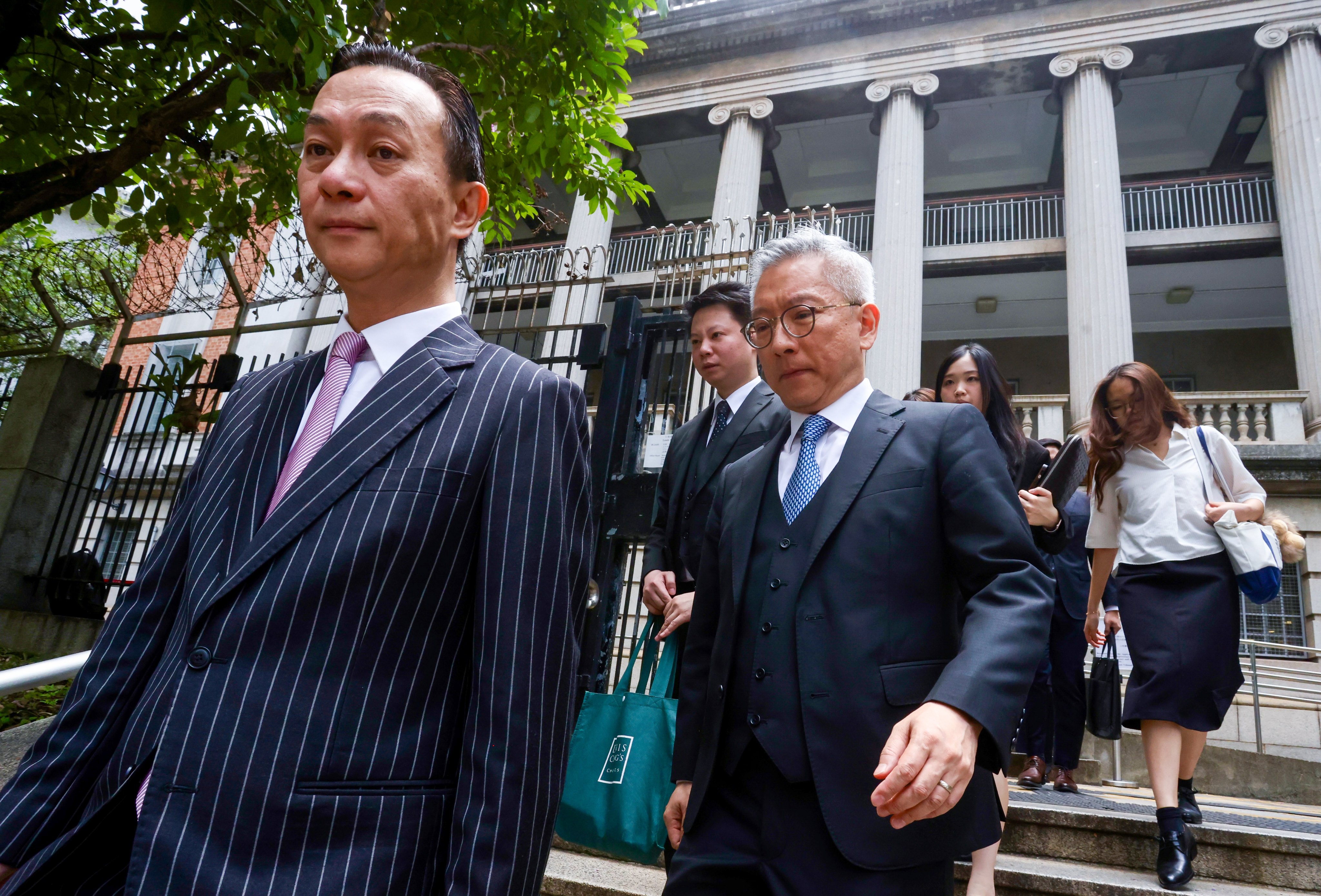 Hectar Pun Hei SC (left), representing Hop On Management Company, at the Lands Tribunal in Yau Ma Tei on Monday. Photo: Jonathan Wong