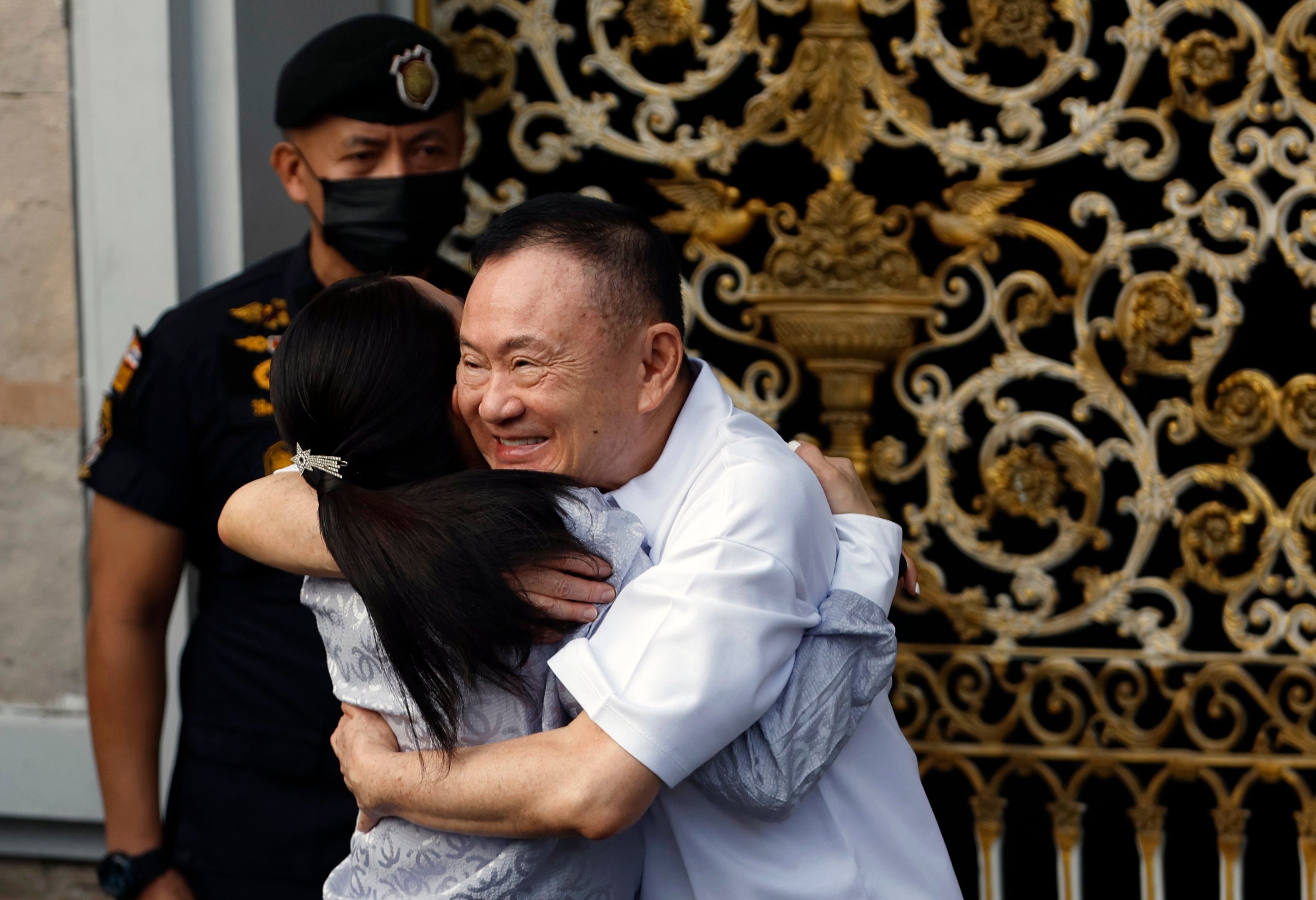 Ex-Thai prime minister Thaksin Shinawatra hugs his daughter and former prime minister Paetongtarn Shinawatra after being released from prison on parole at Klong Prem Central Prison in Bangkok last month. Photo: EPA