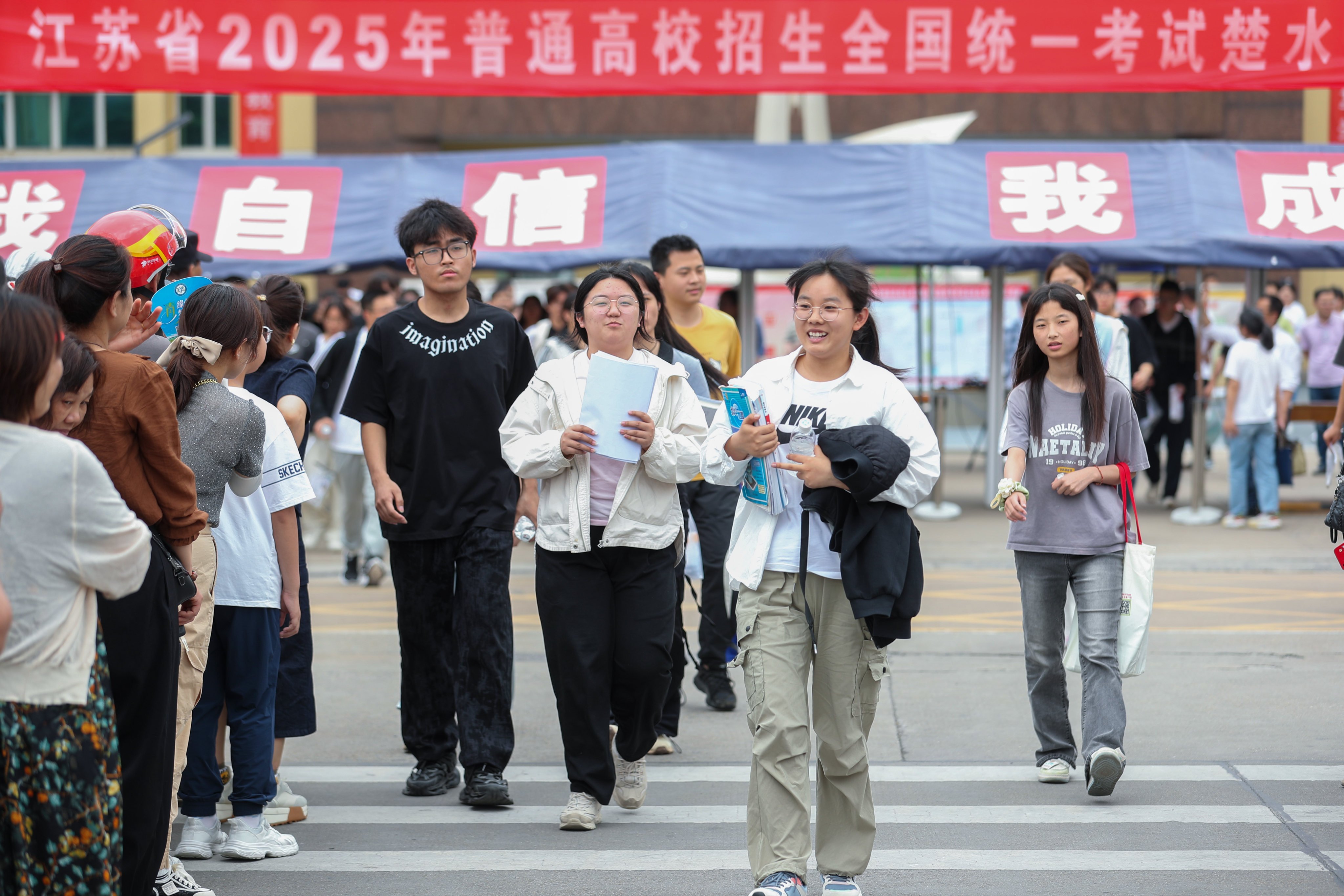 Students walk out of an examination hall after sitting China’s national college entrance exam in the eastern Jiangsu province. Photo: Xinhua