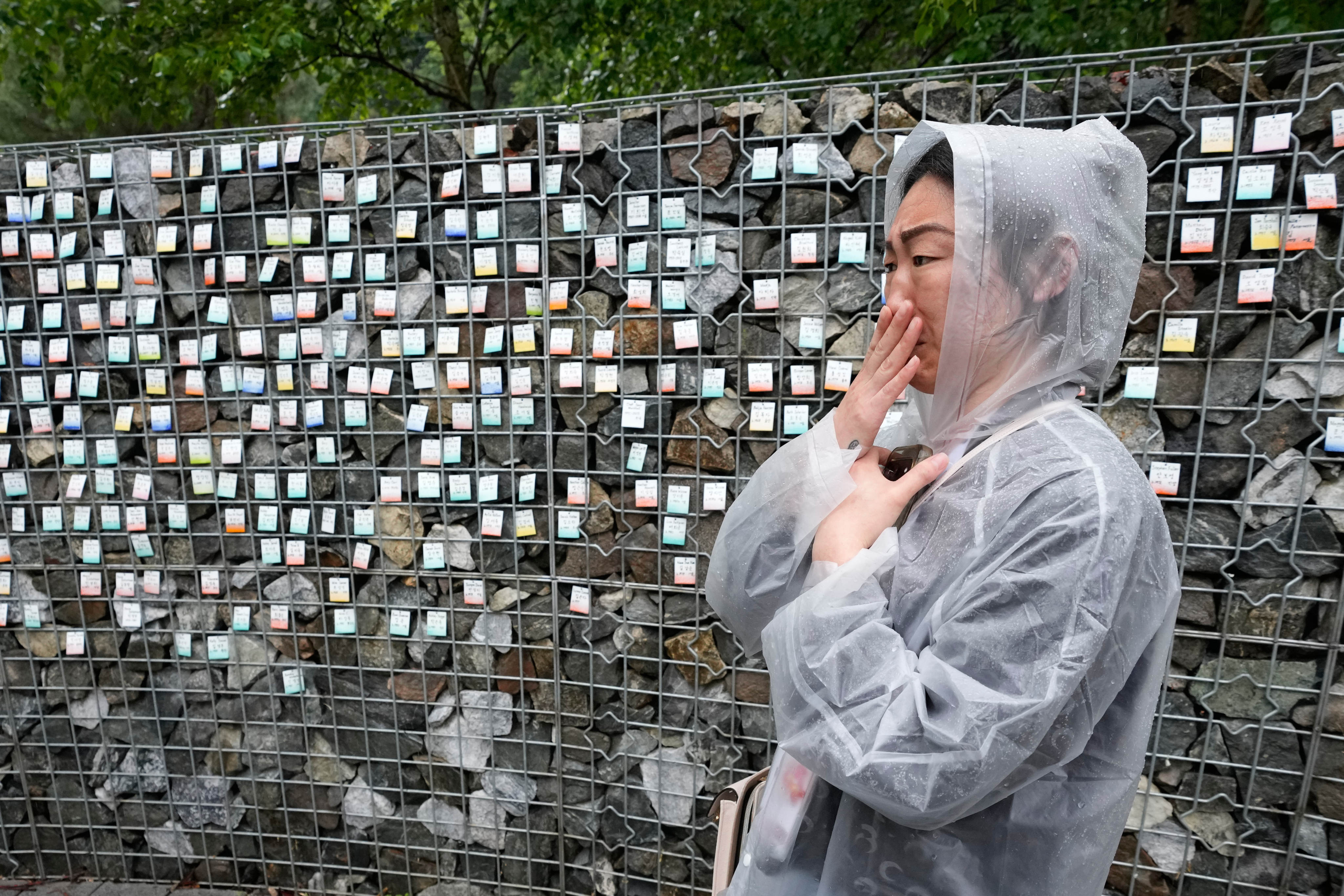 Lisa Robinson, a Korean adoptee from the United States, stands in front of The Wall of Names at Omma Poom Park in Paju, South Korea, on May 20, 2026. Photo: AP/Ahn Young-joon
