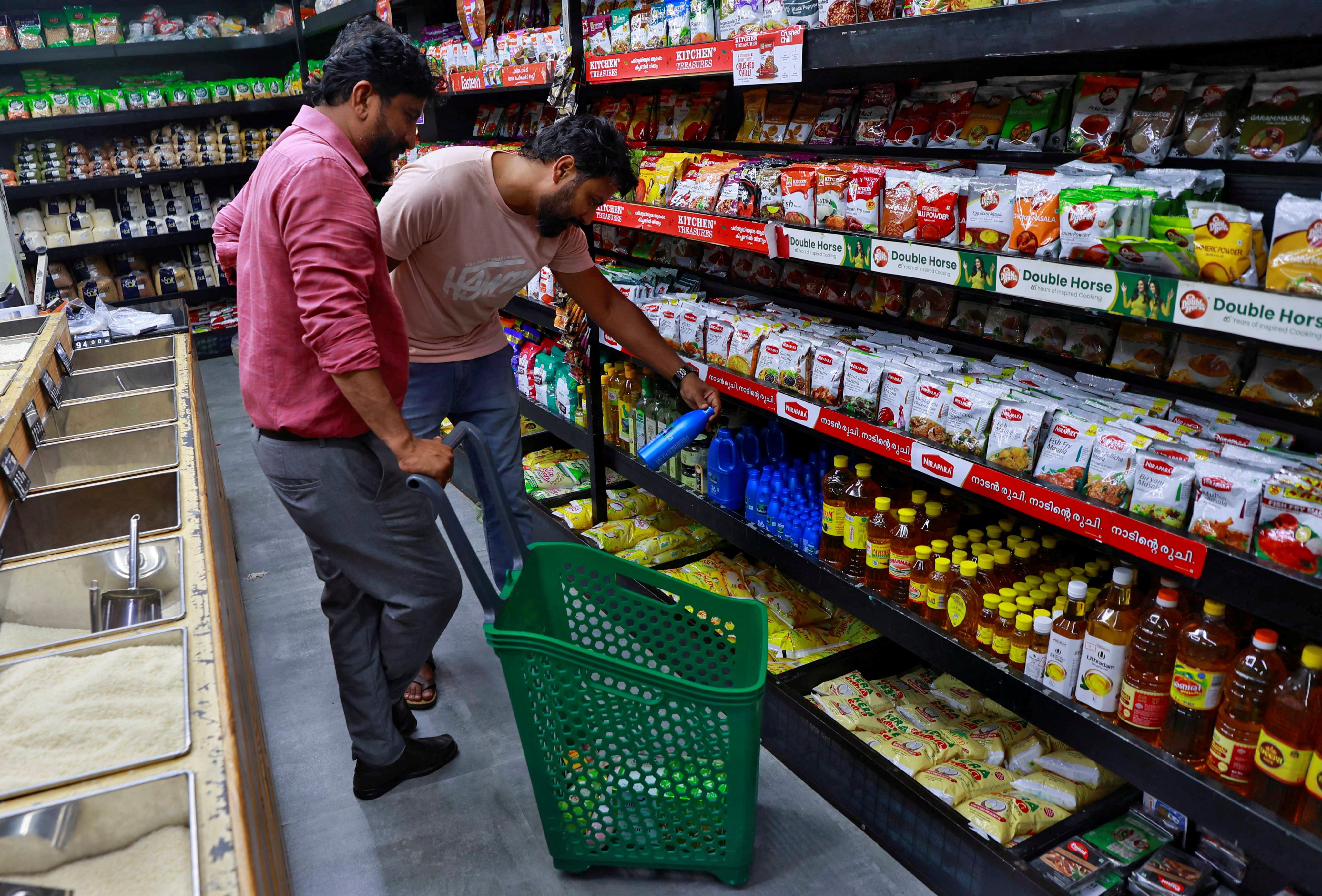 Customers check out products at a retail store in Kochi, India. Photo: Reuters