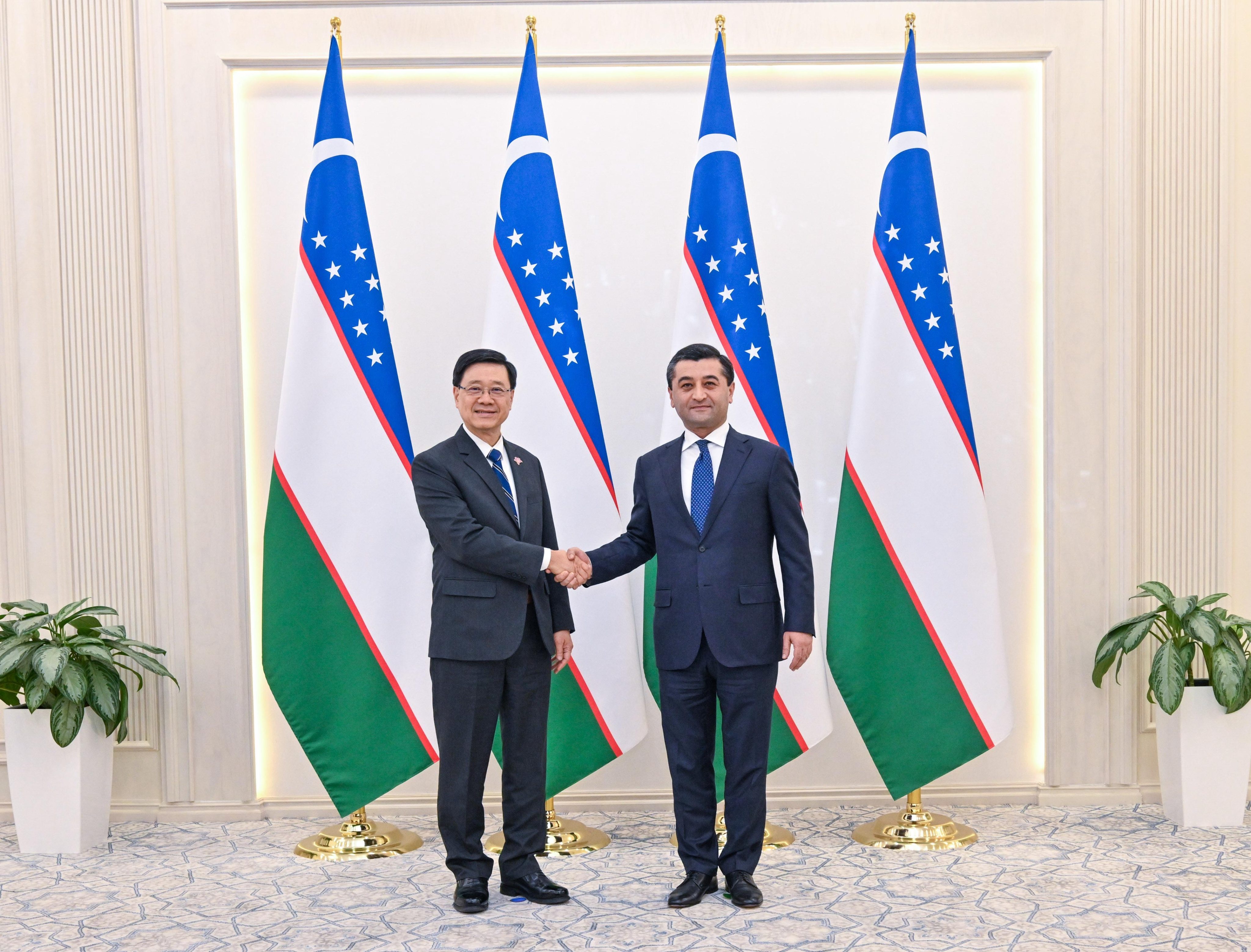 Chief Executive John Lee alongside Uzbekistan’s Foreign Affairs Minister Bakhtiyor Saidov. Photo: Handout