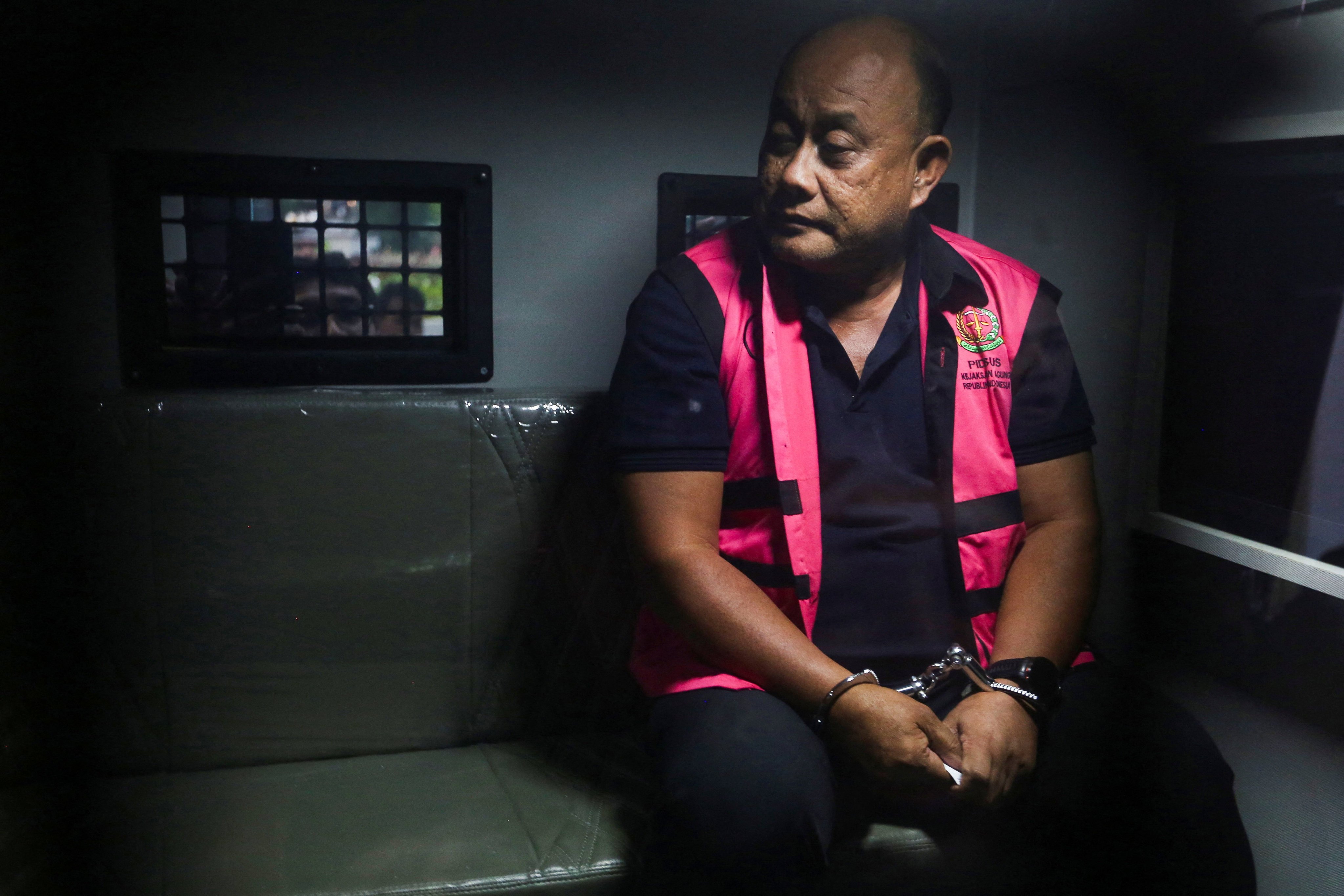 Dadan Hindayana, the National Nutrition Agency former chief, sits inside a detention car after he was arrested by Indonesia's Attorney General's Office (AGO) on charges of causing state losses and enriching himself, in Jakarta, Indonesia, June 3, 2026. REUTERS/Stringer